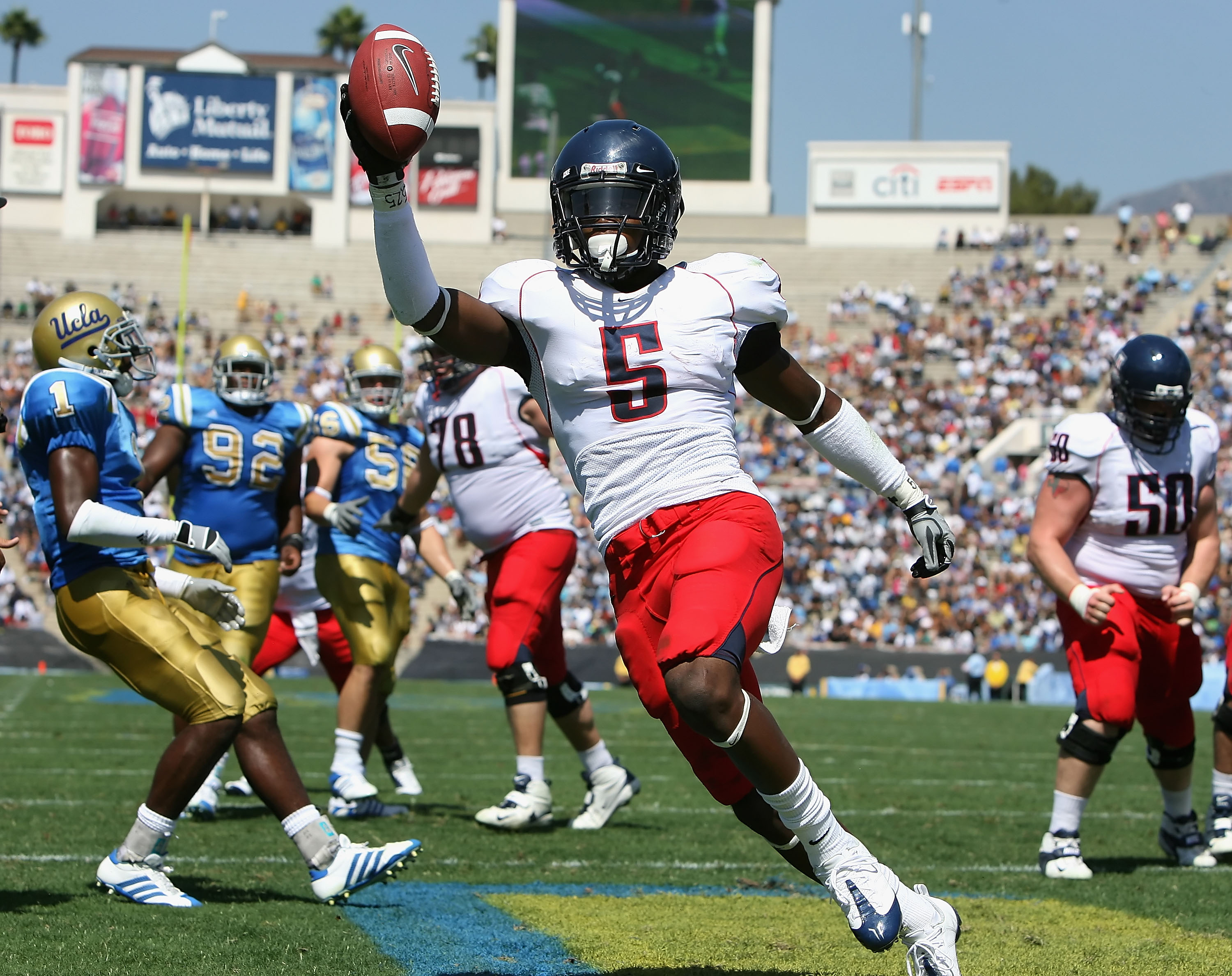 PASADENA, CA - SEPTEMBER 20: Running back Nic Grigsby #5 of the Arizona Wildcats celebrates after scoring a 3 yard rushing touchdown against the UCLA Bruins during the second quarter of the college football game at the Rose Bowl on September 20, 2008 in
