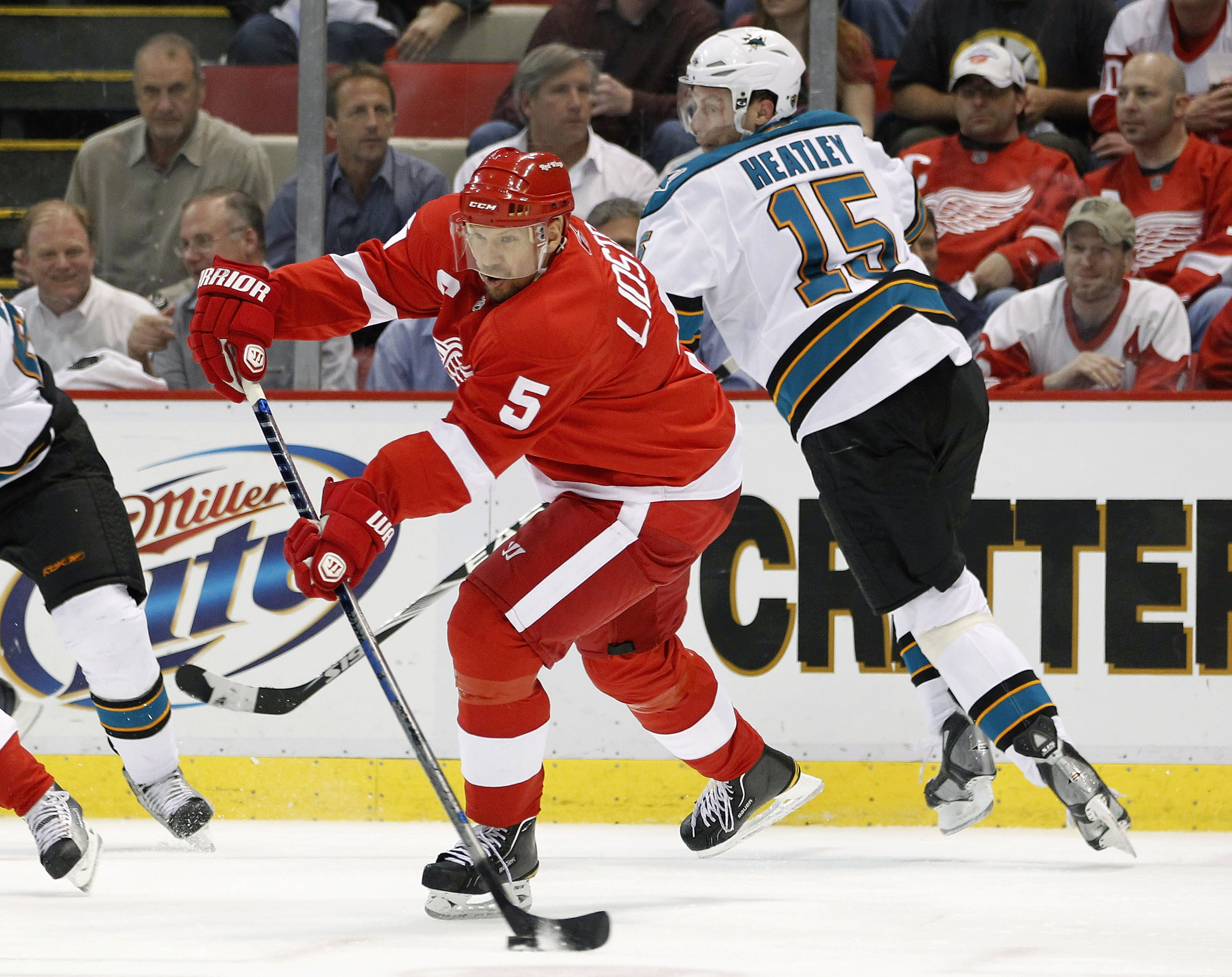 DETROIT - MAY 06: Nicklas Lidstrom #5 of the Detroit Red Wings passes away from Danny Heatley #15 of the San Jose Sharks during Game Four of the Western Conference Semifinals of the 2010 NHL Stanley Cup Playoffs on May 6, 2010 at Joe Louis Arena in Detroi