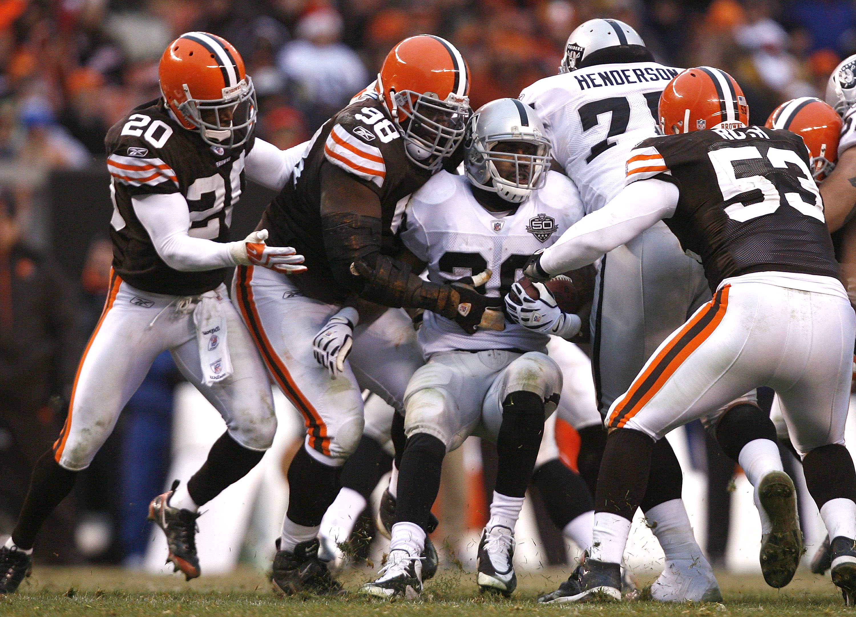 Oakland Raiders running back Darren McFadden (20) pushes off of Kansas City  Chiefs safety Jarrad Page (44) during the first half of an NFL football  game Sunday, Sept. 20, 2009, in Kansas