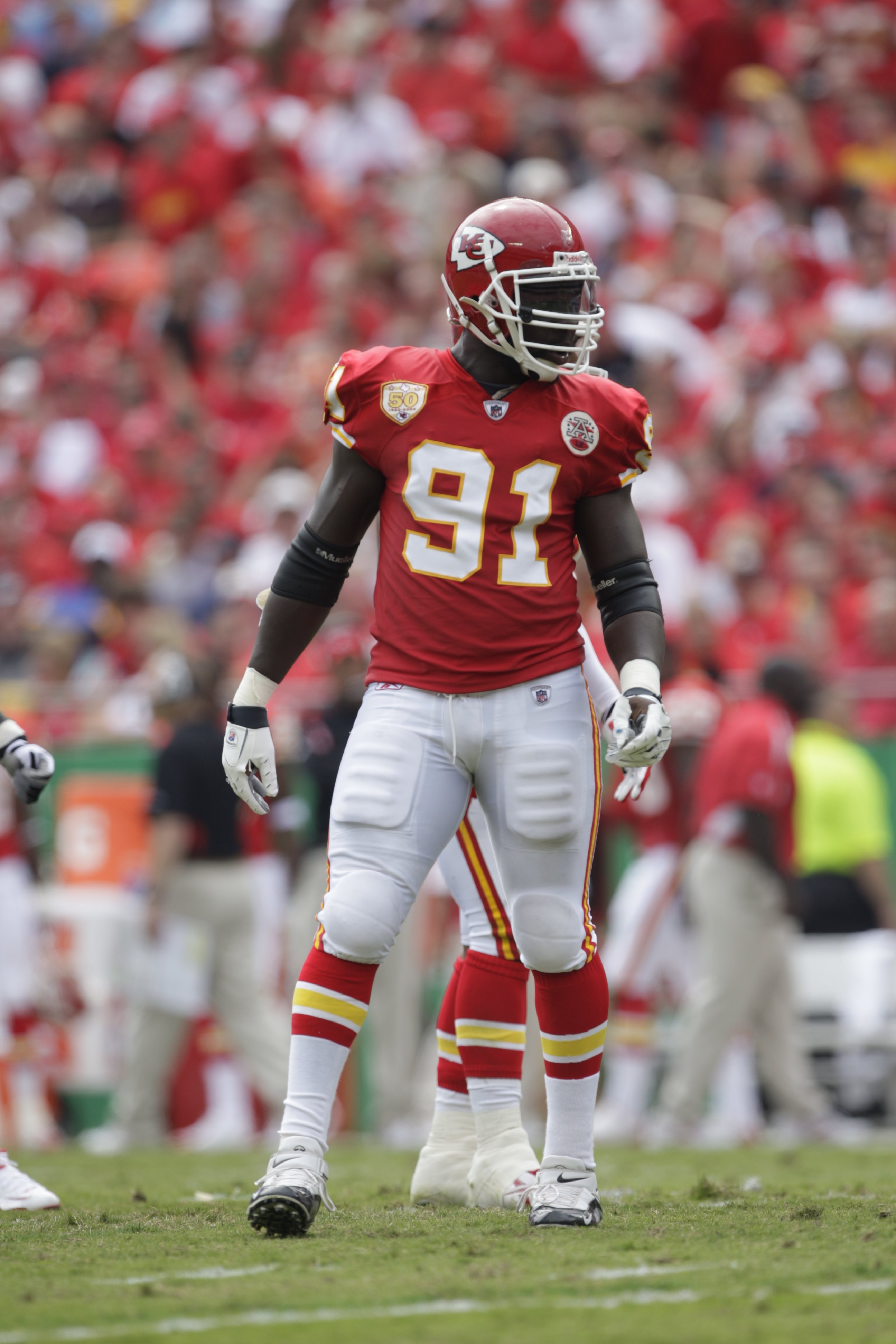 Kansas City Chiefs linebackers Justin Houston (50) and Tamba Hali (91) walk  between drills at NFL football t…