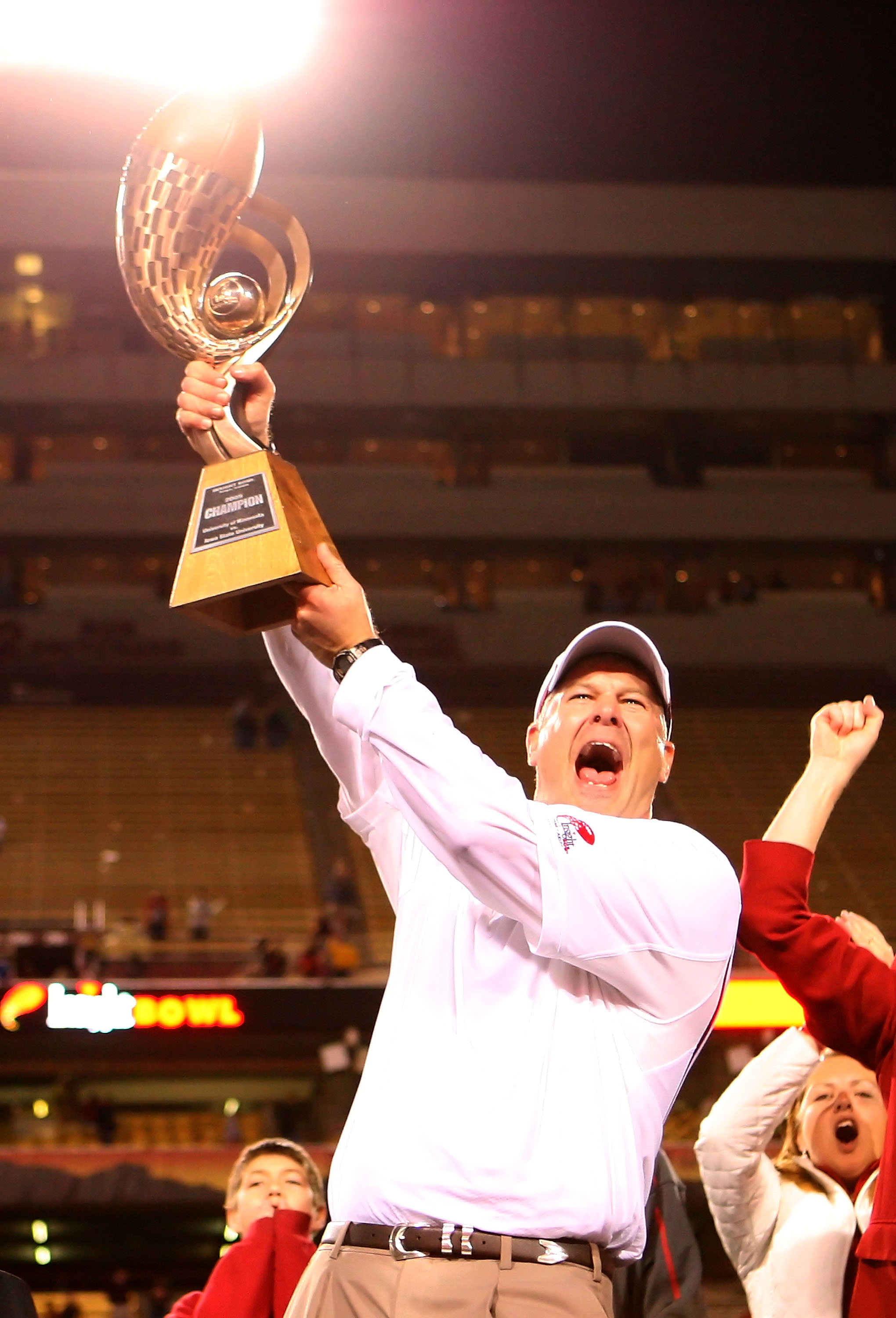 TEMPE, AZ - DECEMBER 31: Head coach Paul Rhoads of the Iowa State Cyclones celebrates with the Insight Bowl trophy after defeating the Minnesota Golden Gophers at Arizona Stadium on December 31, 2009 in Tempe, Arizona. The Cyclones defeated the Golden G