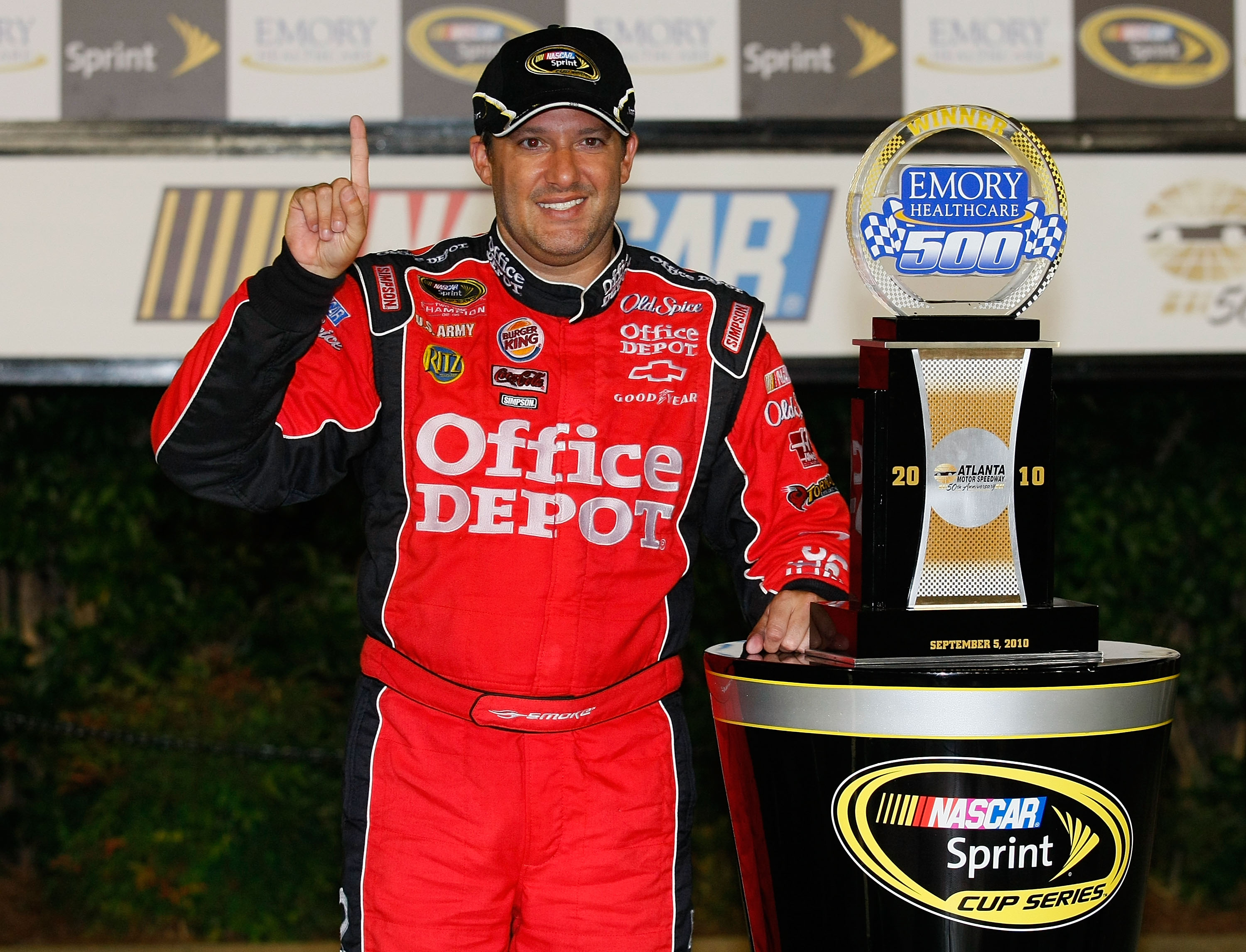 HAMPTON, GA - SEPTEMBER 05: Tony Stewart, driver of the #14 Office Depot/Old Spice Chevrolet, celebrates in victory lane after winning the NASCAR Sprint Cup Series Emory Healthcare 500 at Atlanta Motor Speedway on September 5, 2010 in Hampton, Georgia.  (