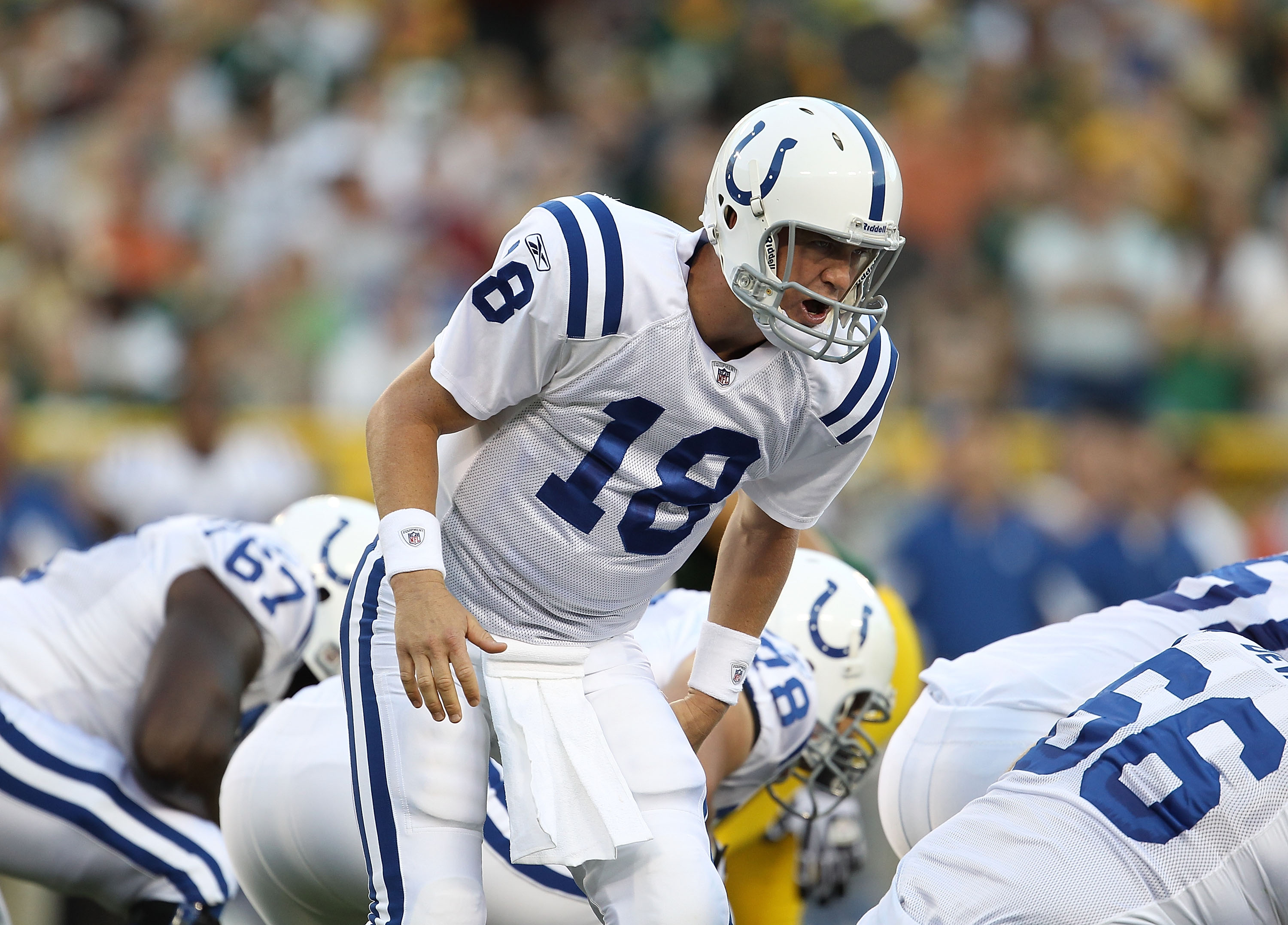 GREEN BAY, WI - AUGUST 26: Peyton Manning #18 of the Indianapolis Colts calls a play during a preseason game against the Green Bay Packers at Lambeau Field on August 26, 2010 in Green Bay, Wisconsin. The Packers defeated the Colts 59-24.  (Photo by Jonath