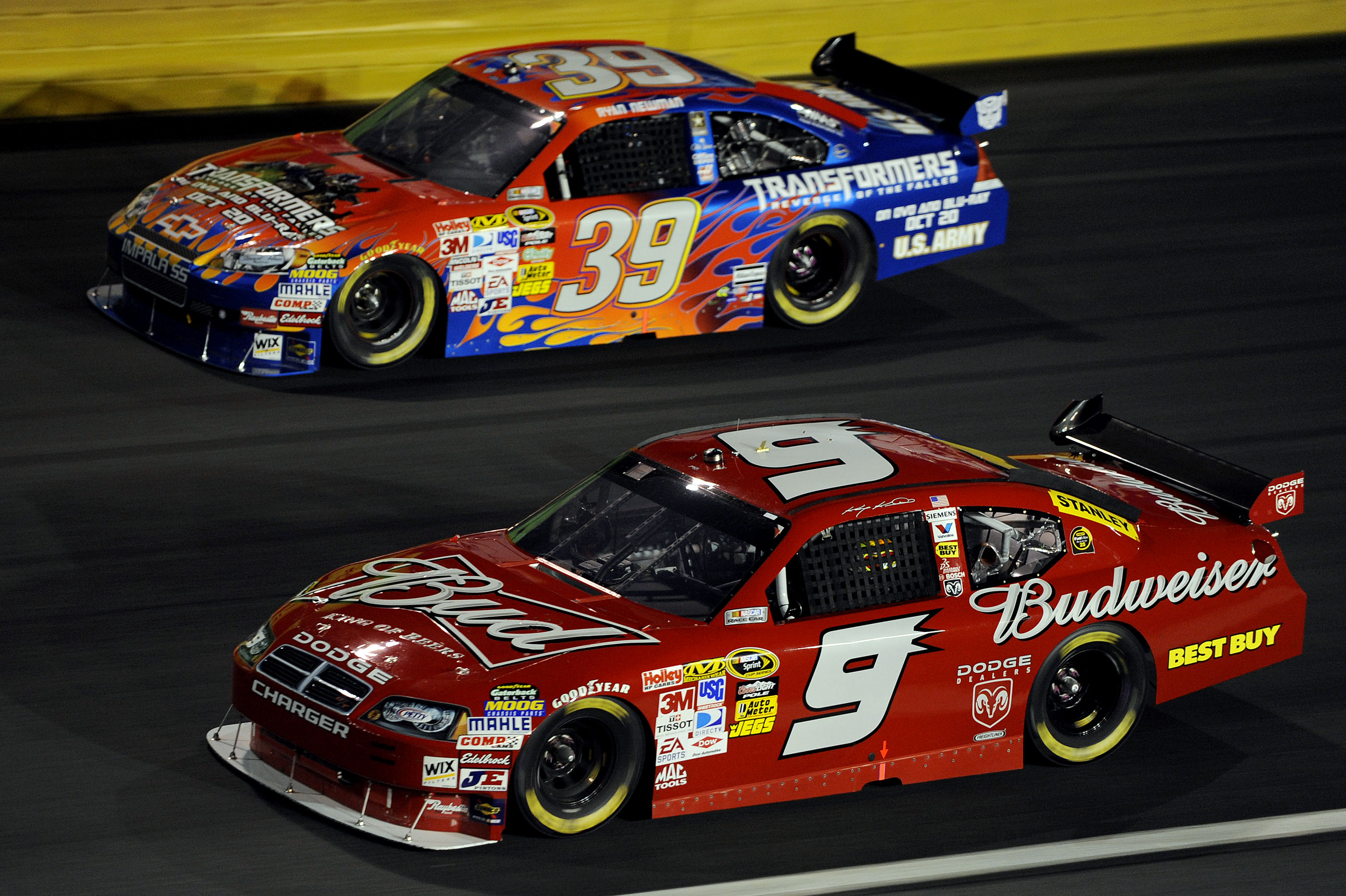 CONCORD, NC - OCTOBER 17:  Ryan Newman, driver of the #39 Transformers Chevrolet, races Kasey Kahne, driver of the #9 Budweiser Dodge, during the NASCAR Sprint Cup Series NASCAR Banking 500 at Lowe's Motor Speedway on October 17, 2009 in Concord, North Ca