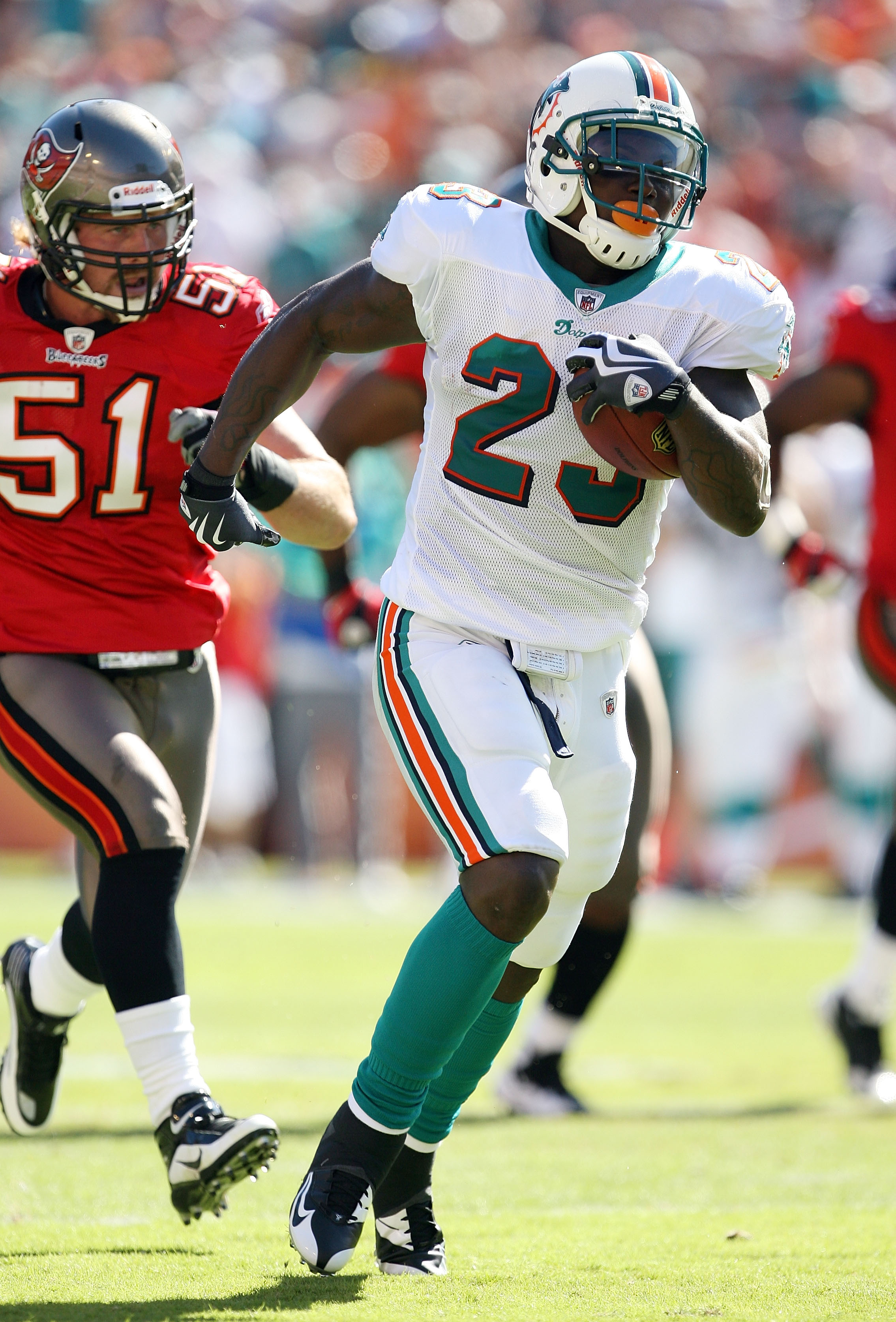 Miami Dolphins safety Jason Allen (32) celebrates after the Dolphins  stopped Denver Broncos Jay Cutler late in the fourth quarter at Invesco  Field at Mile High in Denver on November 2, 2008.