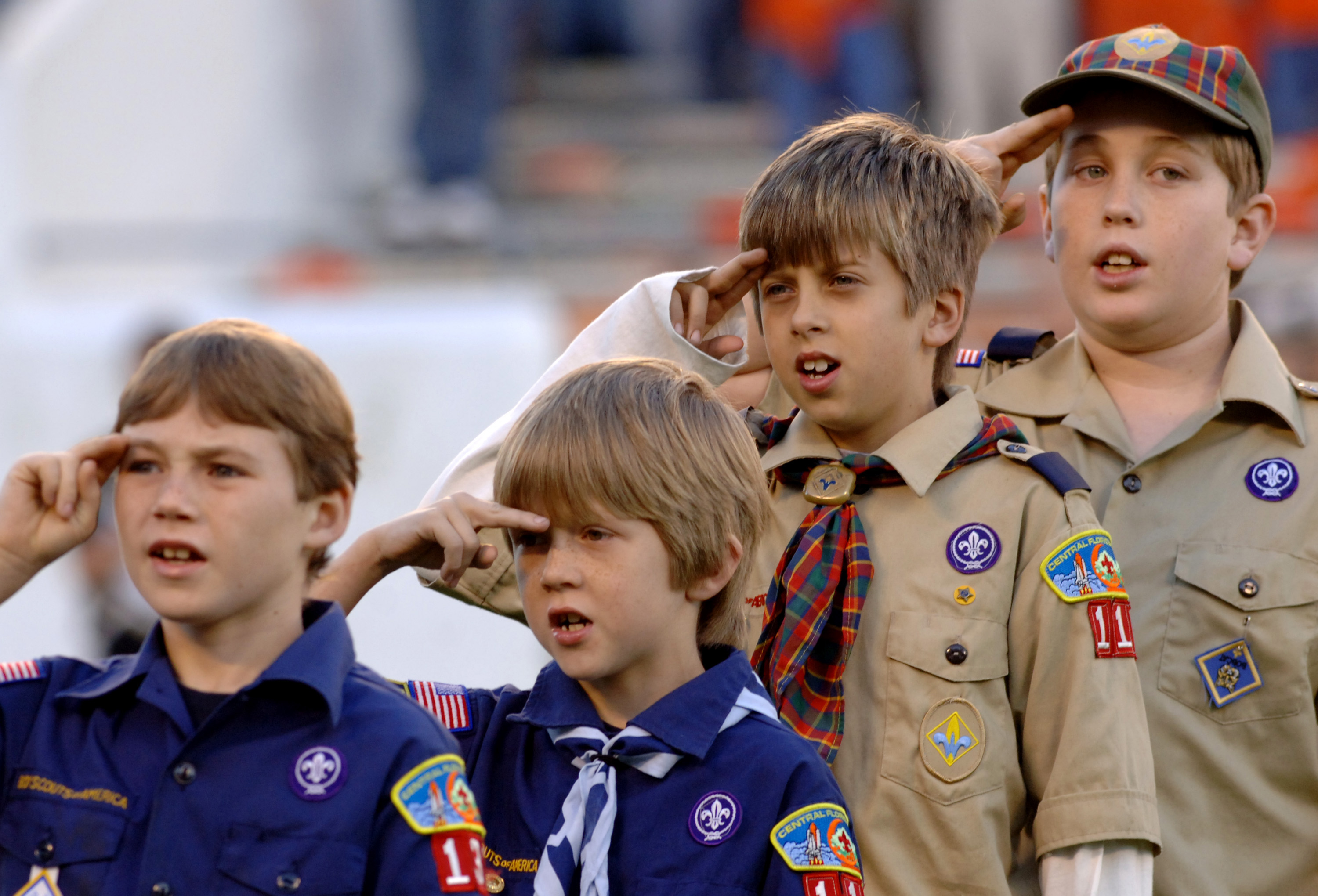 Scouts of all sizes salute during the Pledge of Allegiance before  the 2005 Champs Sports Bowl December 27 in Orlando.  Clemson defeated Colorado 19 - 10. (Photo by A. Messerschmidt/Getty Images) *** Local Caption ***