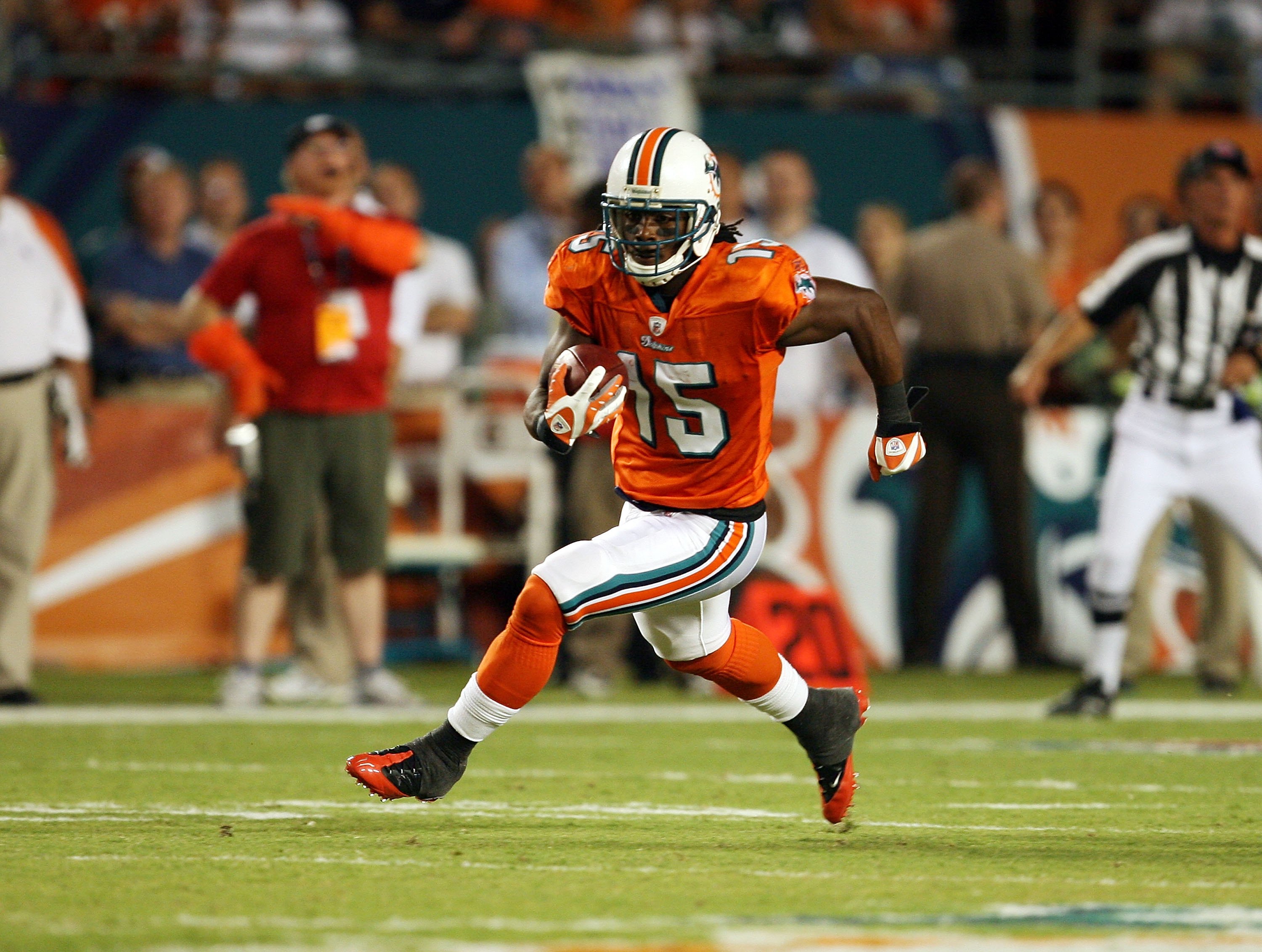 File:Miami Dolphins wide receiver Brandon Marshall of the American Football  Conference runs through the secondary