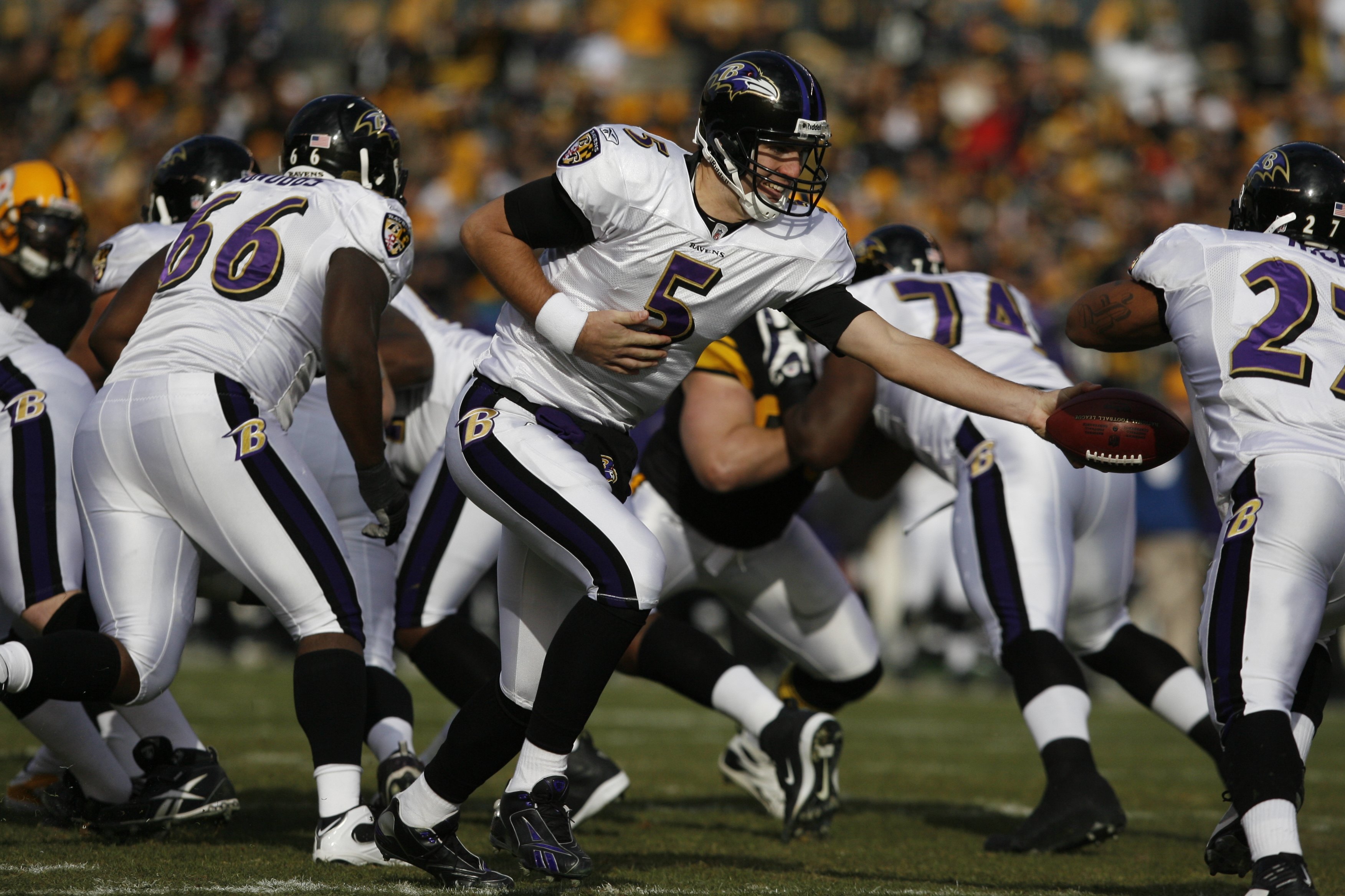 PITTSBURGH - DECEMBER 27:  Joe Flacco #5 of the Baltimore Ravens hands off during the game against the Pittsburgh Steelers on December 27, 2009 at Heinz Field in Pittsburgh, Pennsylvania. (Photo by Gregory Shamus/Getty Images)