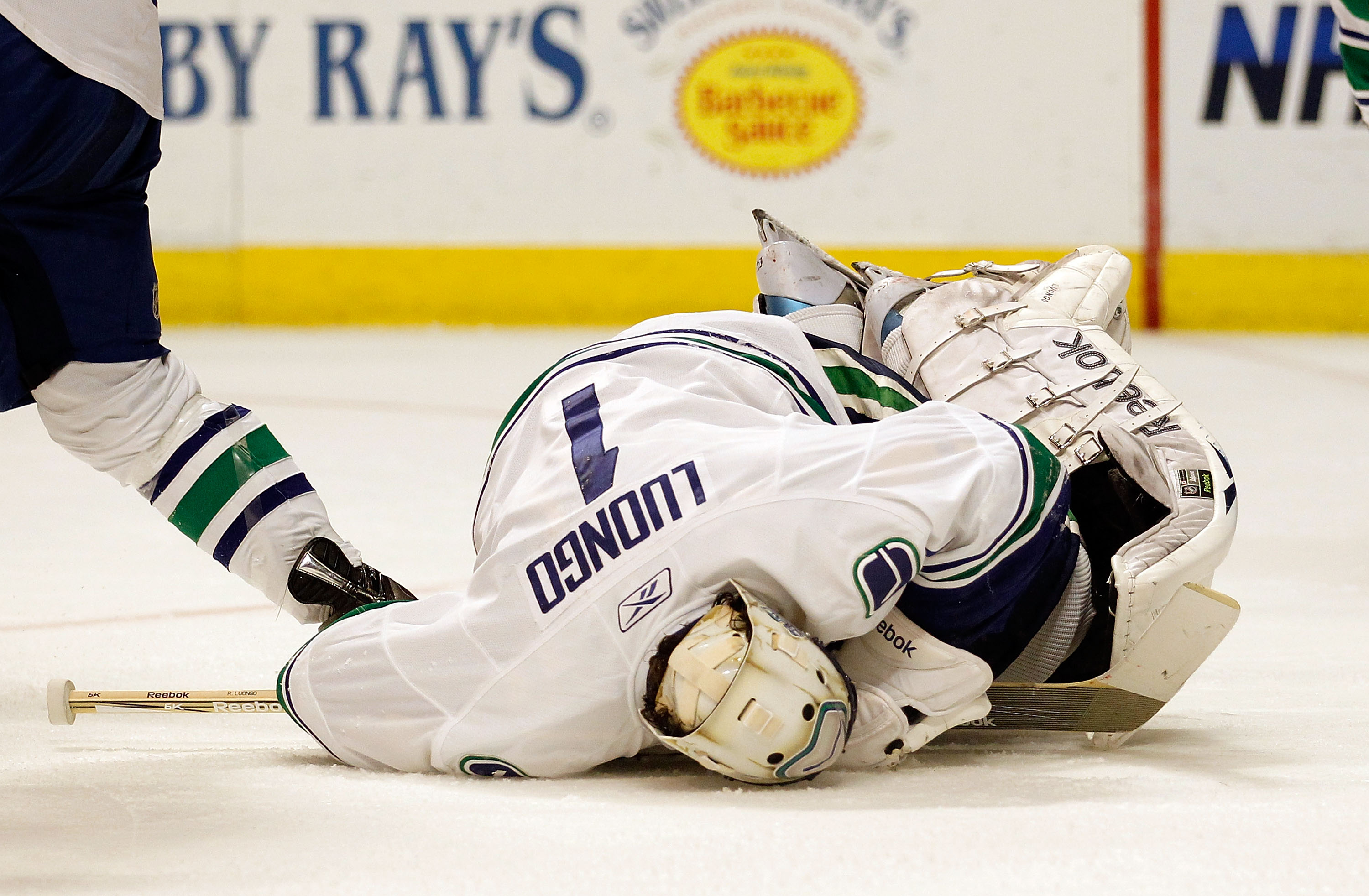 CHICAGO - MAY 03: Roberto Luongo #1 of the Vancouver Canucks falls on the puck for a save against the Chicago Blackhawks in Game Two of the Western Conference Semifinals during the 2010 NHL Stanley Cup Playoffs at United Center on May 3, 2010 in Chicago,