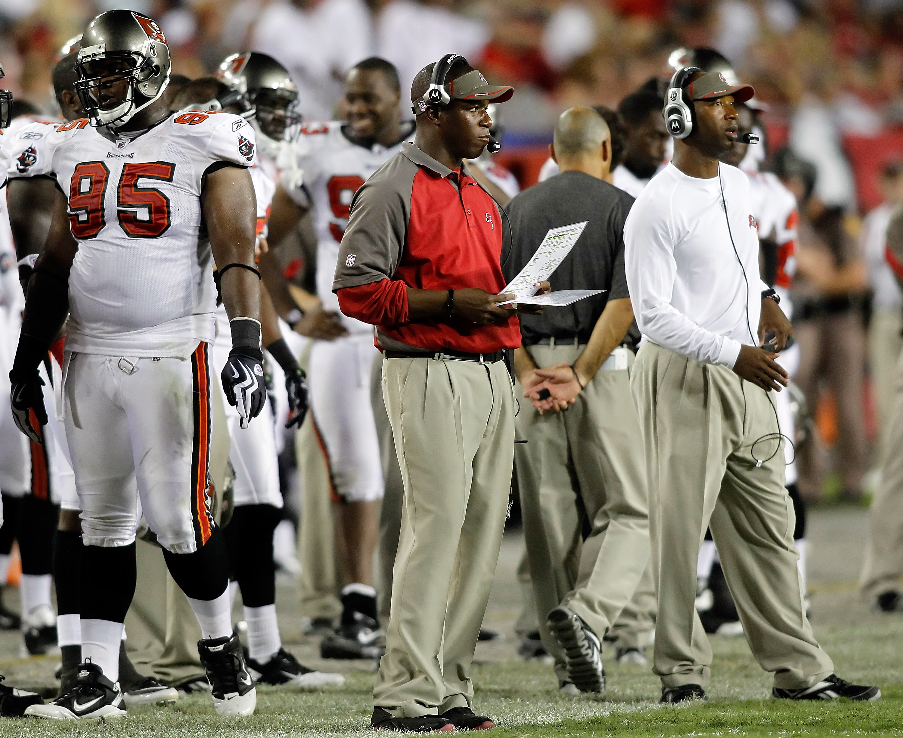 13 SEP 2009: Head Coach Raheem Morris of the Buccaneers in the red shirt  watches the instant replay during the game between the Dallas Cowboys and  the Tampa Bay Buccaneers at Raymond