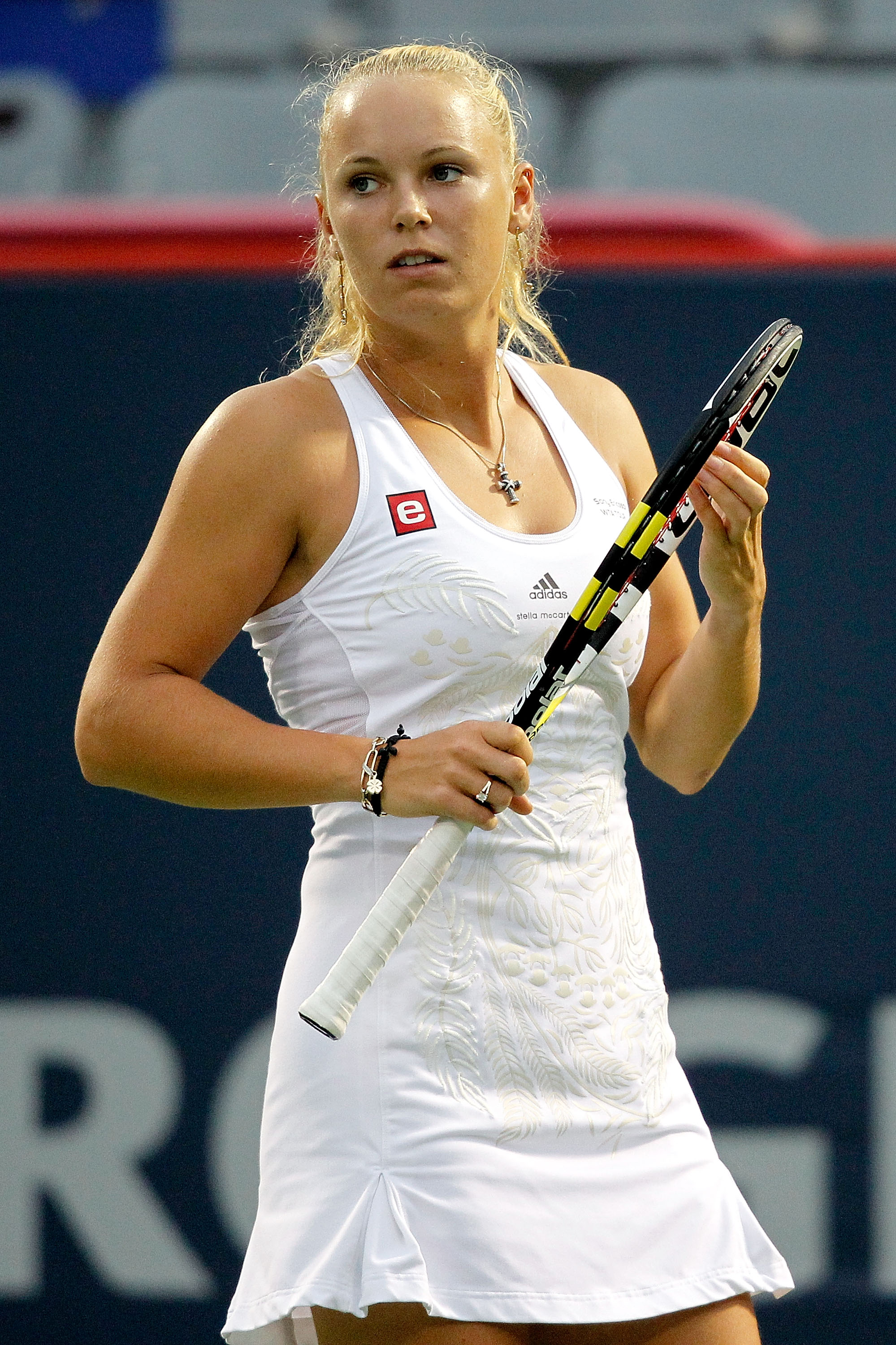 MONTREAL, QC - AUGUST 21:  Caroline Wozniacki of Denmark adjusts her racquet between points while playing Svetlana Kuznetsova of Russia during the semifinals of the Rogers Cup at Stade Uniprix on August 21, 2010 in Montreal, Canada.  (Photo by Matthew Sto
