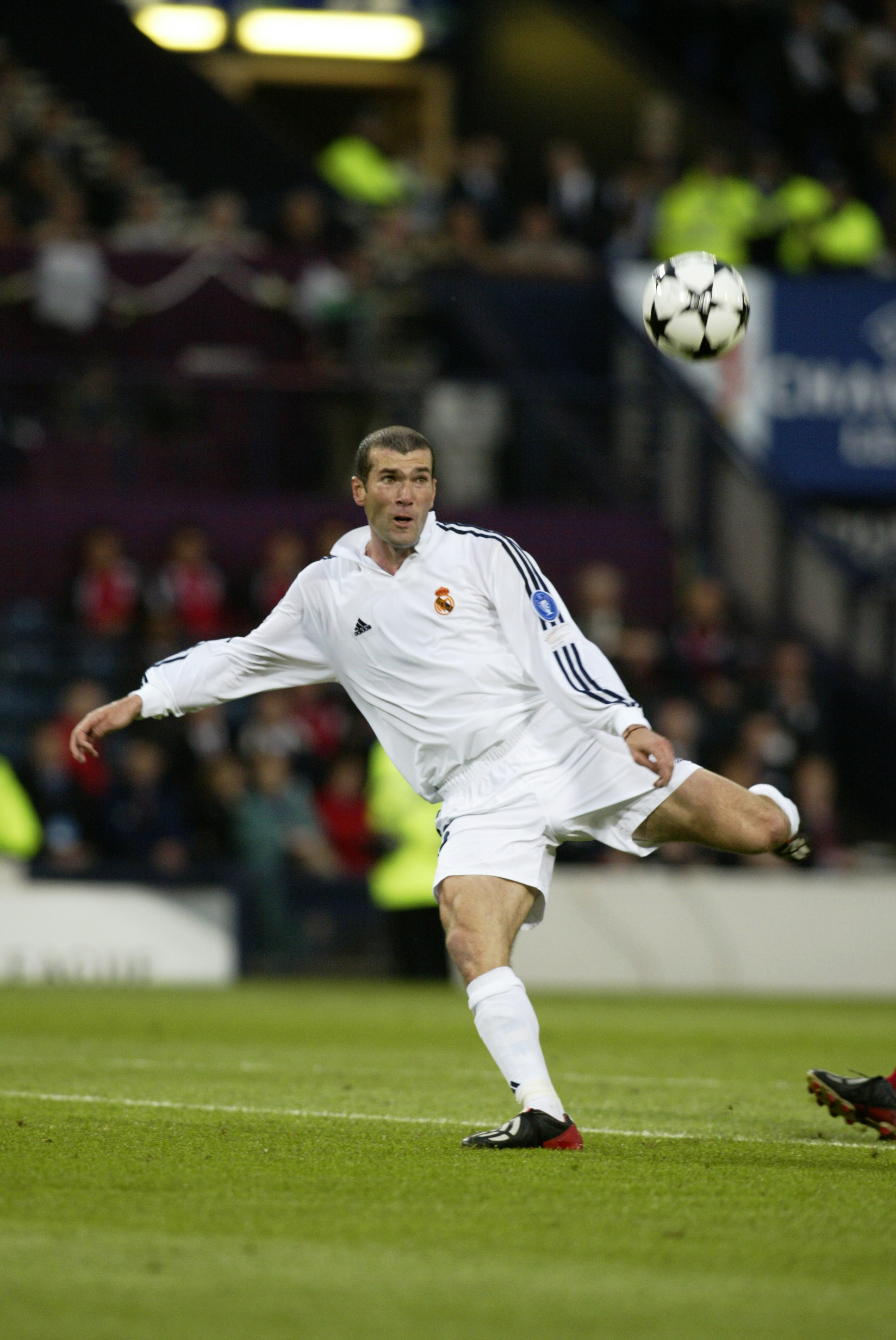 GLASGOW - May 15:  Zinedine Zidane of Real Madrid keeps his eye on the ball as he scores a wonderful goal during the UEFA Champions League Final between Real Madrid and Bayer Leverkusen played at Hampden Park, in Glasgow, Scotland on May 15, 2002. Real Ma