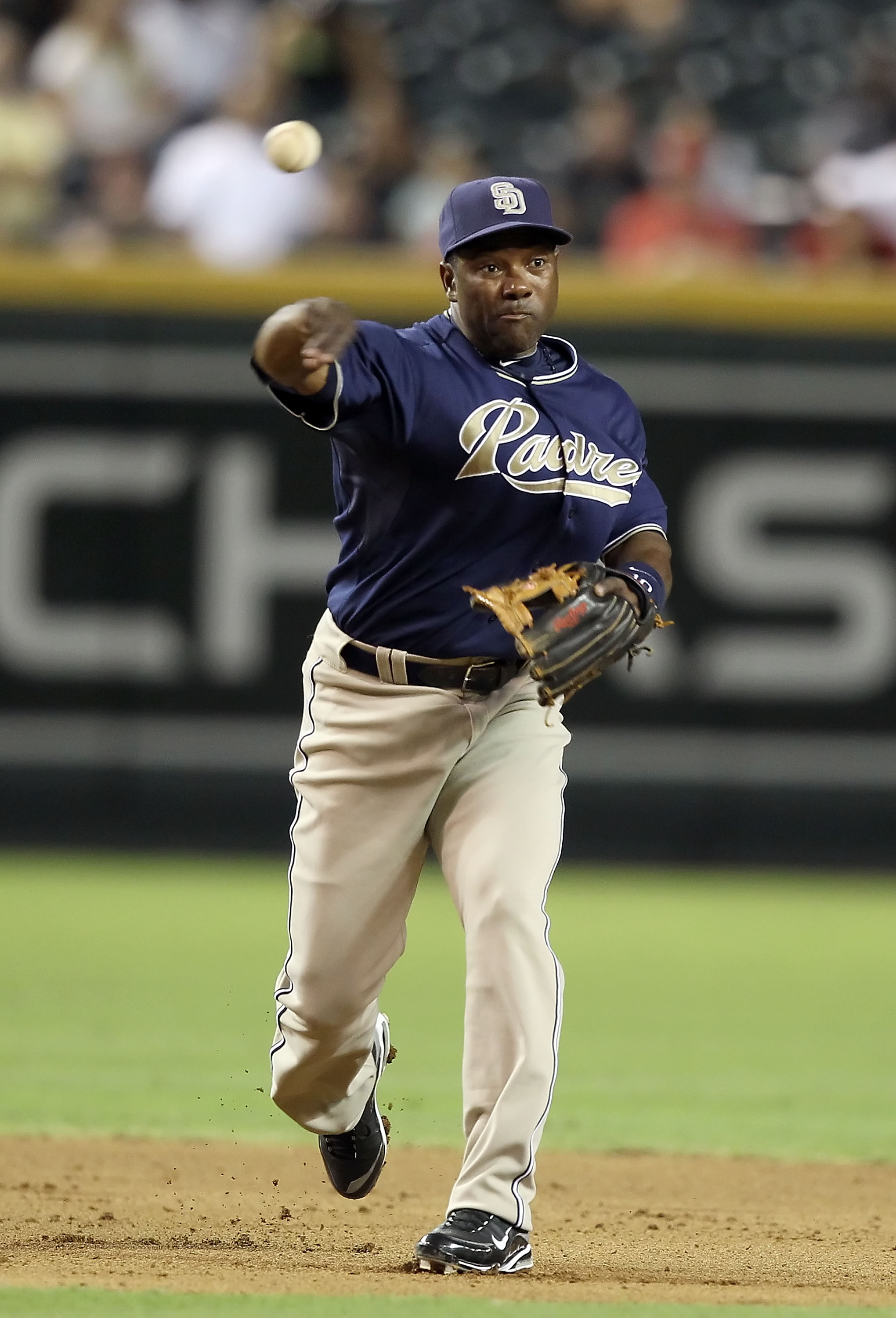 PHOENIX - AUGUST 30:  Infielder Miguel Tejada #10 of the San Diego Padres fields a ground ball out during the Major League Baseball game against the Arizona Diamondbacks at Chase Field on August 30, 2010 in Phoenix, Arizona. The Diamondbacks defeated the