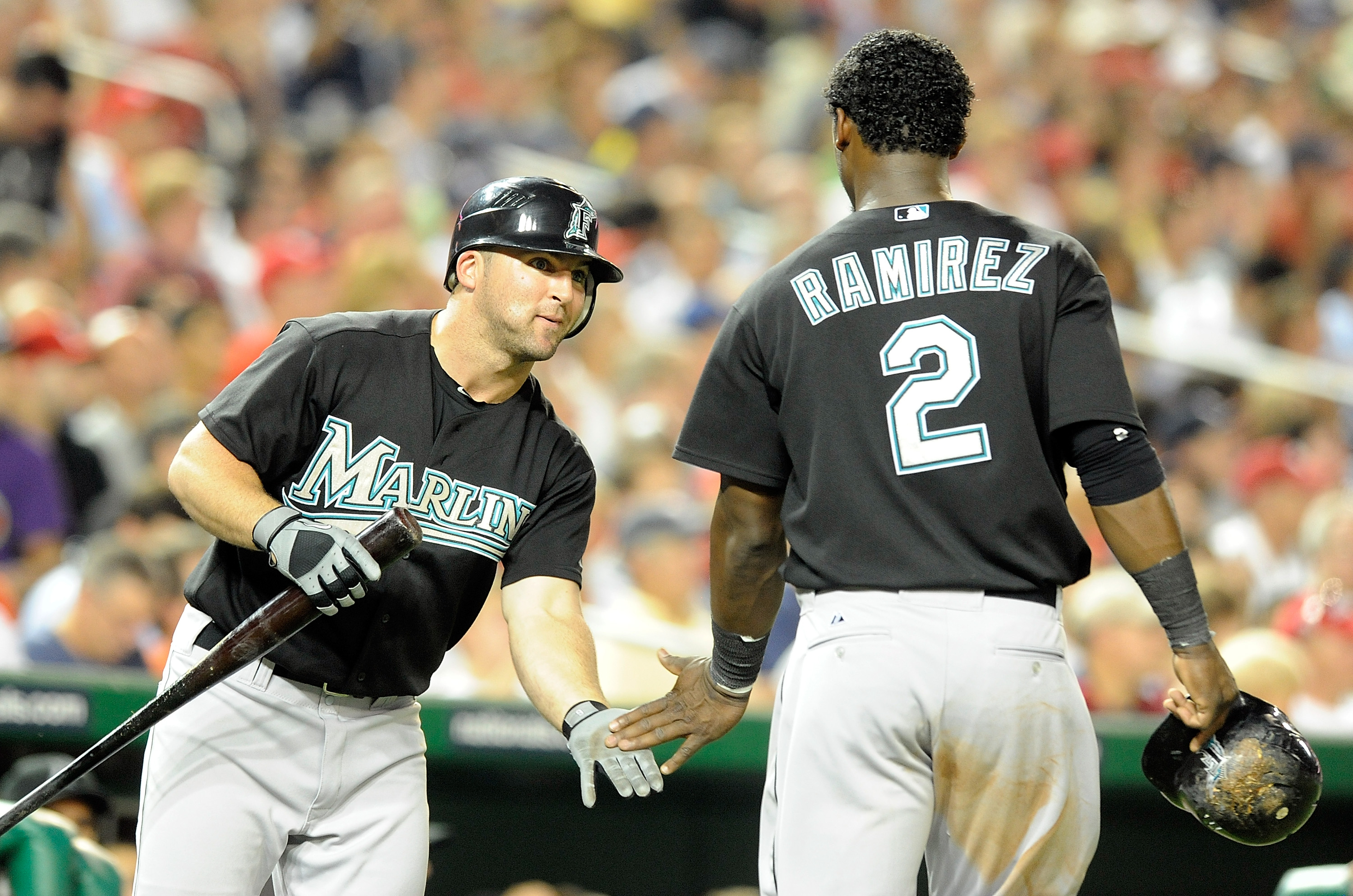 WASHINGTON - AUGUST 10:  Hanley Ramirez #2 of the Florida Marlins is congratulated by Dan Uggla #6 after scoring in the fifth inning against the Washington Nationals at Nationals Park on August 10, 2010 in Washington, DC.  (Photo by Greg Fiume/Getty Image