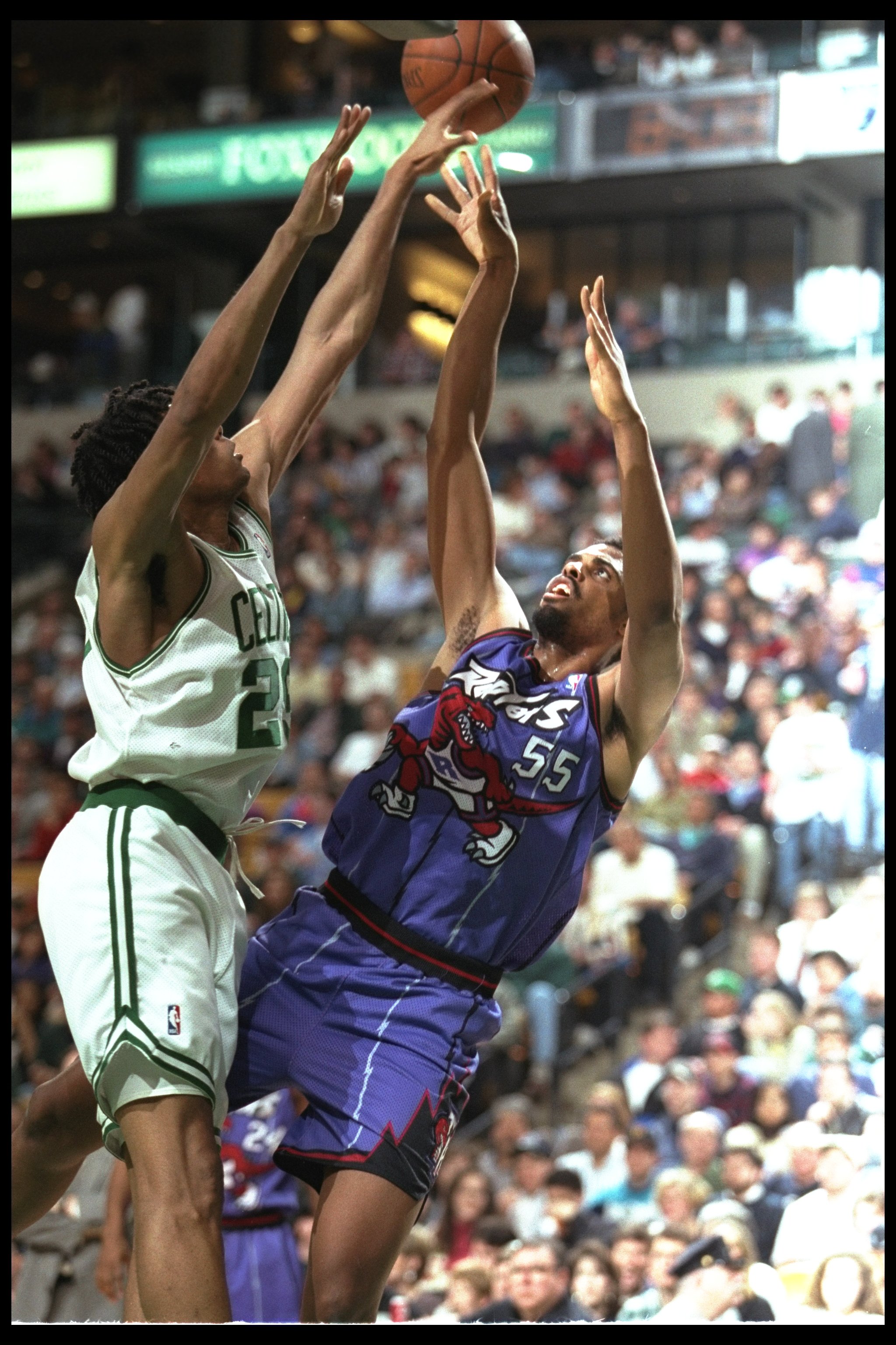 12 Apr 1996:  Center Acie Earl of the Toronto Raptors and Pervis Ellison of the Boston Celtics fight for the ball during a game played at the Fleet Center in Boston, Massachusetts.  The Celtics won the game, 136-108. Mandatory Credit: ALLSPORT USA  /Allsp