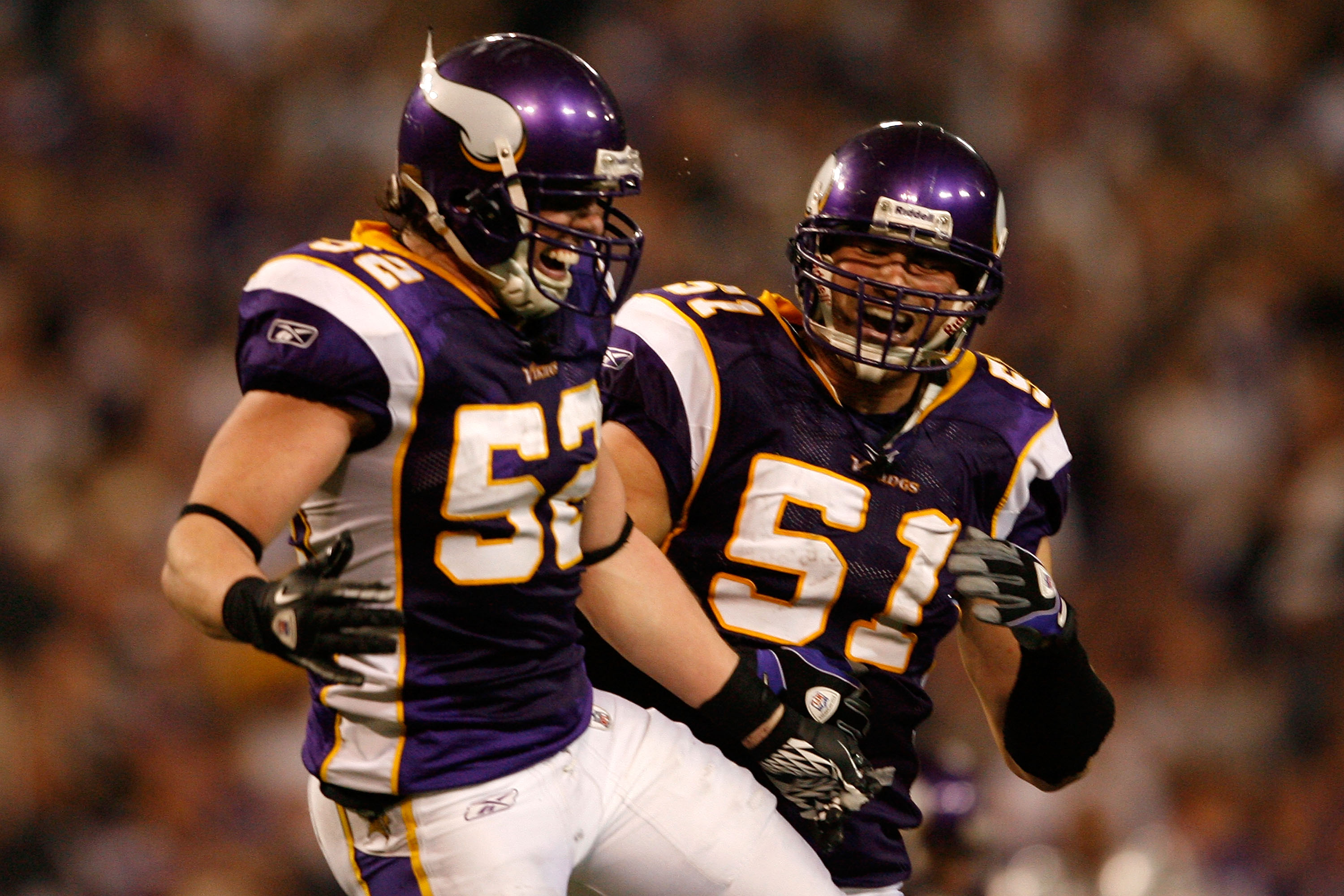 Minnesota Vikings Chad Greenway (C) celebrates his 37 yard interception  return for a touchdown against the New York Giants in the fourth quarter  with Ben Leber (51) at Giants Stadium in East