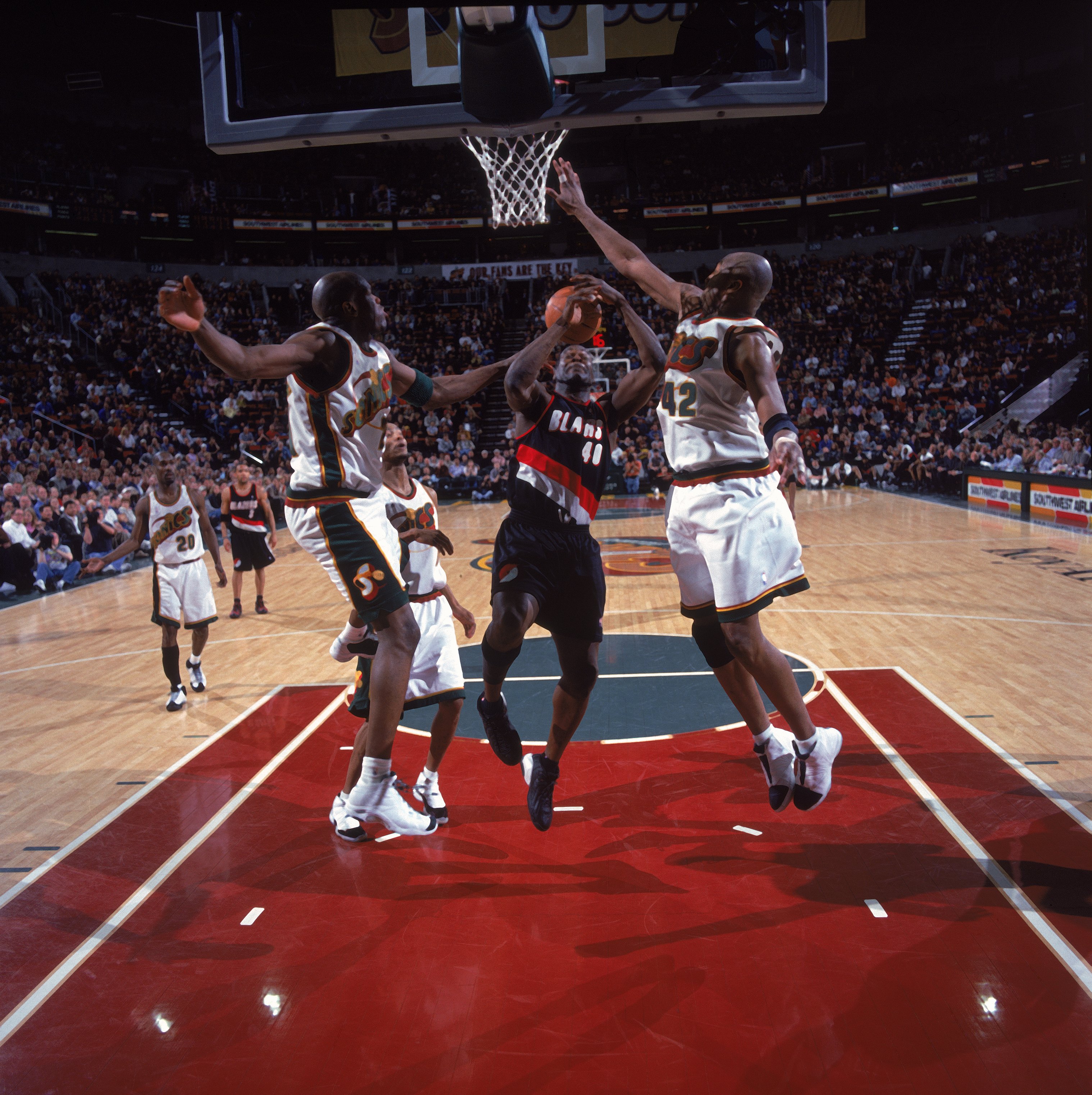 13 Mar 2001:  Shawn Kemp #40 of the Portland Trail Blazers shoots the ball against Vin Baker #42 and Ruben Patterson #21 of the Seattle SuperSonics during the game at the Key Arena in Seattle, Washington. The Sonics defeated the Blazers 99-90.  NOTE TO US