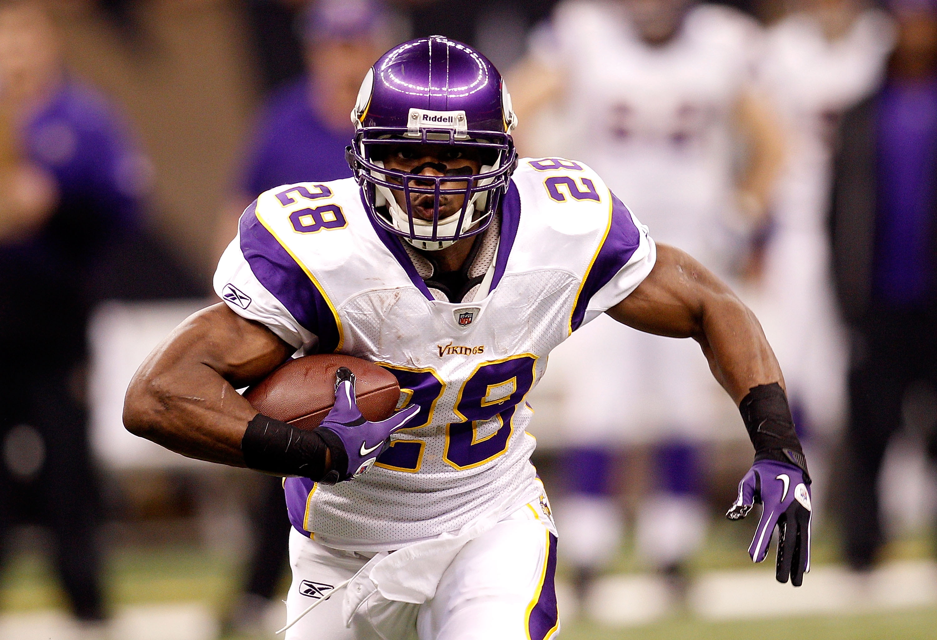 Minnesota Vikings Chad Greenway celebrates his 37 yard interception return  for a touchdown against the New York Giants in the fourth quarter with  teammates E.J. Henderson (56) and Ben Leber (51) at