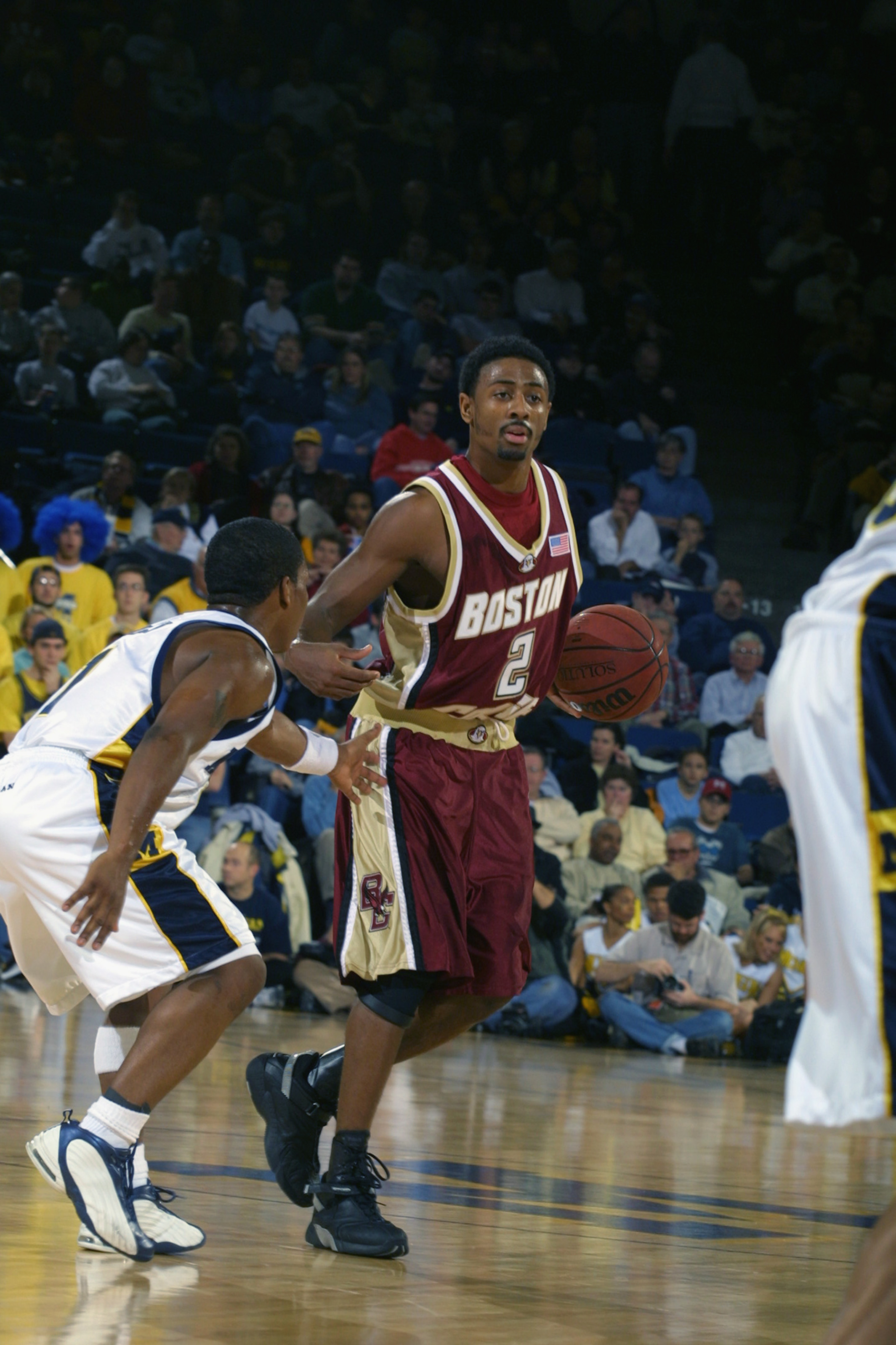ANN ARBOR, MI - DECEMBER 1:  Guard Troy Bell #2 of the Boston College Eagles dribbles the ball against guard Avery Queen #1 of the Michigan Wolverines during the game at Crisler Arena in Ann Arbor, Michigan on December 1, 2001.  Boston College defeated Mi