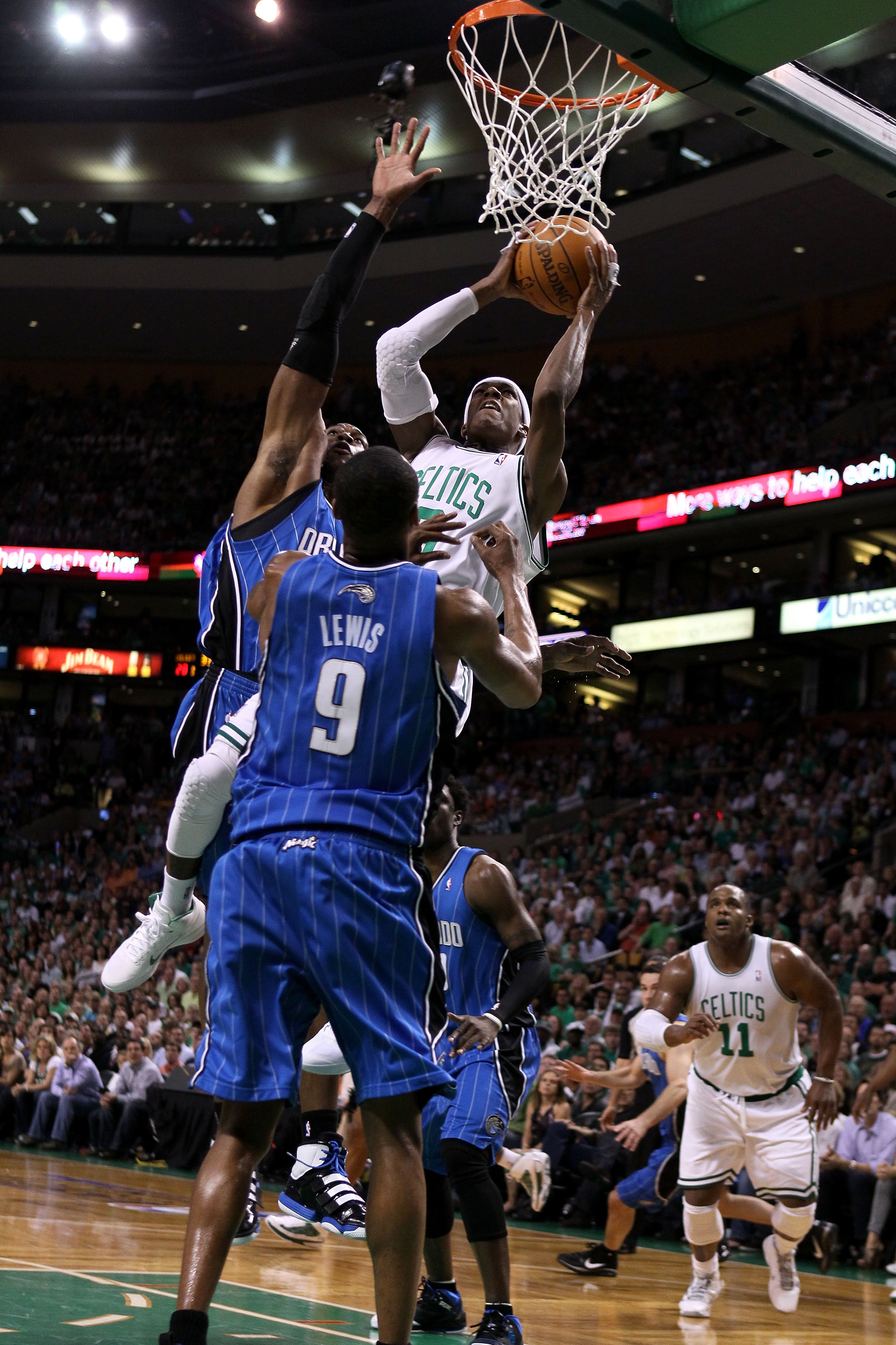 BOSTON - MAY 28:  Rajon Rondo #9 of the Boston Celtics attempts a shot as he falls and was fouled against Dwight Howard #12 of the Orlando Magic in Game Six of the Eastern Conference Finals during the 2010 NBA Playoffs at TD Garden on May 28, 2010 in Bost