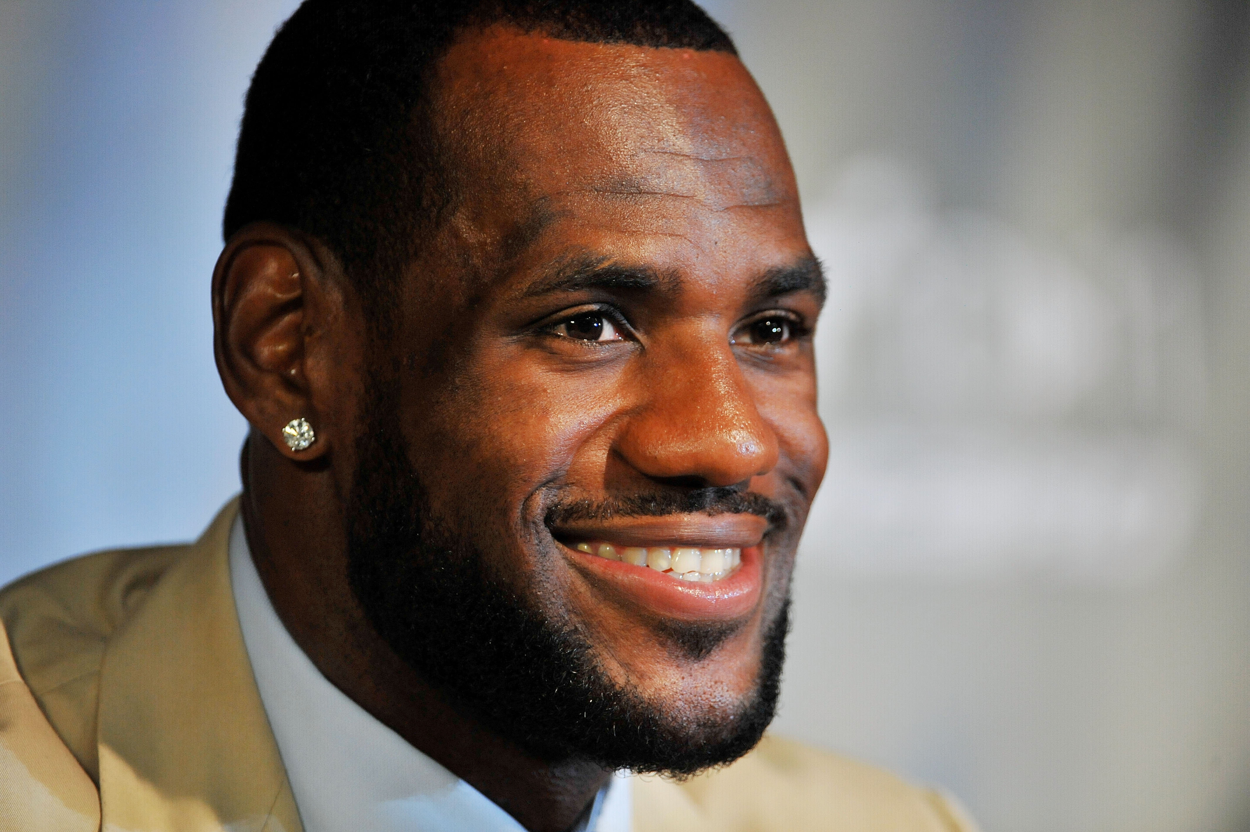 MIAMI - JULY 09:  LeBron James #6, of the Miami Heat smiles during a press conference after a welcome party at American Airlines Arena on July 9, 2010 in Miami, Florida.  (Photo by Doug Benc/Getty Images)