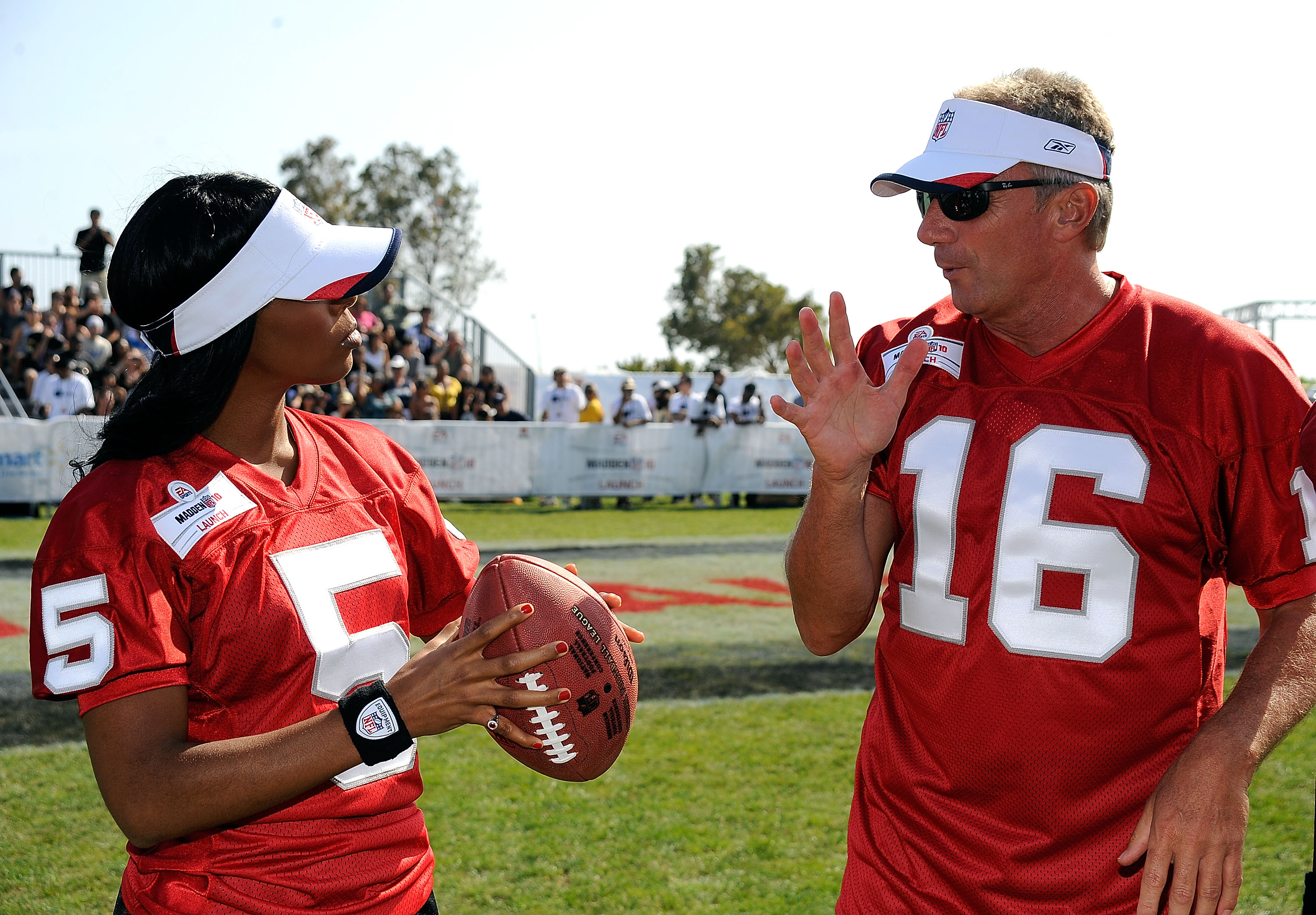 MALIBU, CA - JULY 24:Singer Kelly Rowland gets tips from Joe Montana, athlete at the Madden NFL 10 Pigskiin Pro-Am on Xbox 360 event  on July 24, 2009 in Malibu, California.  (Photo by Frazer Harrison/Getty Images)