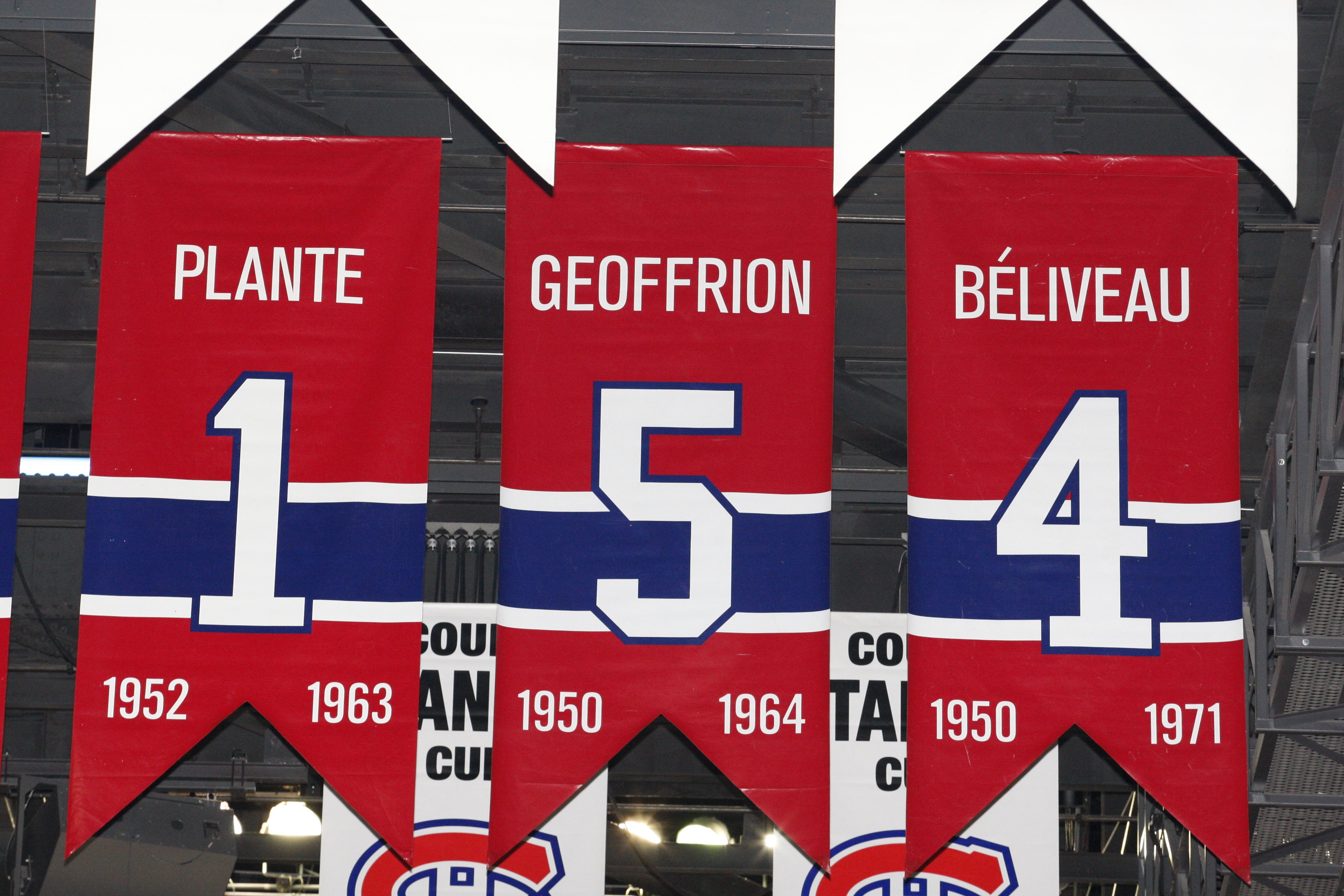 MONTREAL- APRIL 19:  A photo of the banners commemorating the retired jerseys of Jacque Plante, Bernard Geoffrion and Jean Beliveau hanging in the Bell Centre prior to Game Three of the Eastern Conference Quarterfinals between the Washington Capitals and