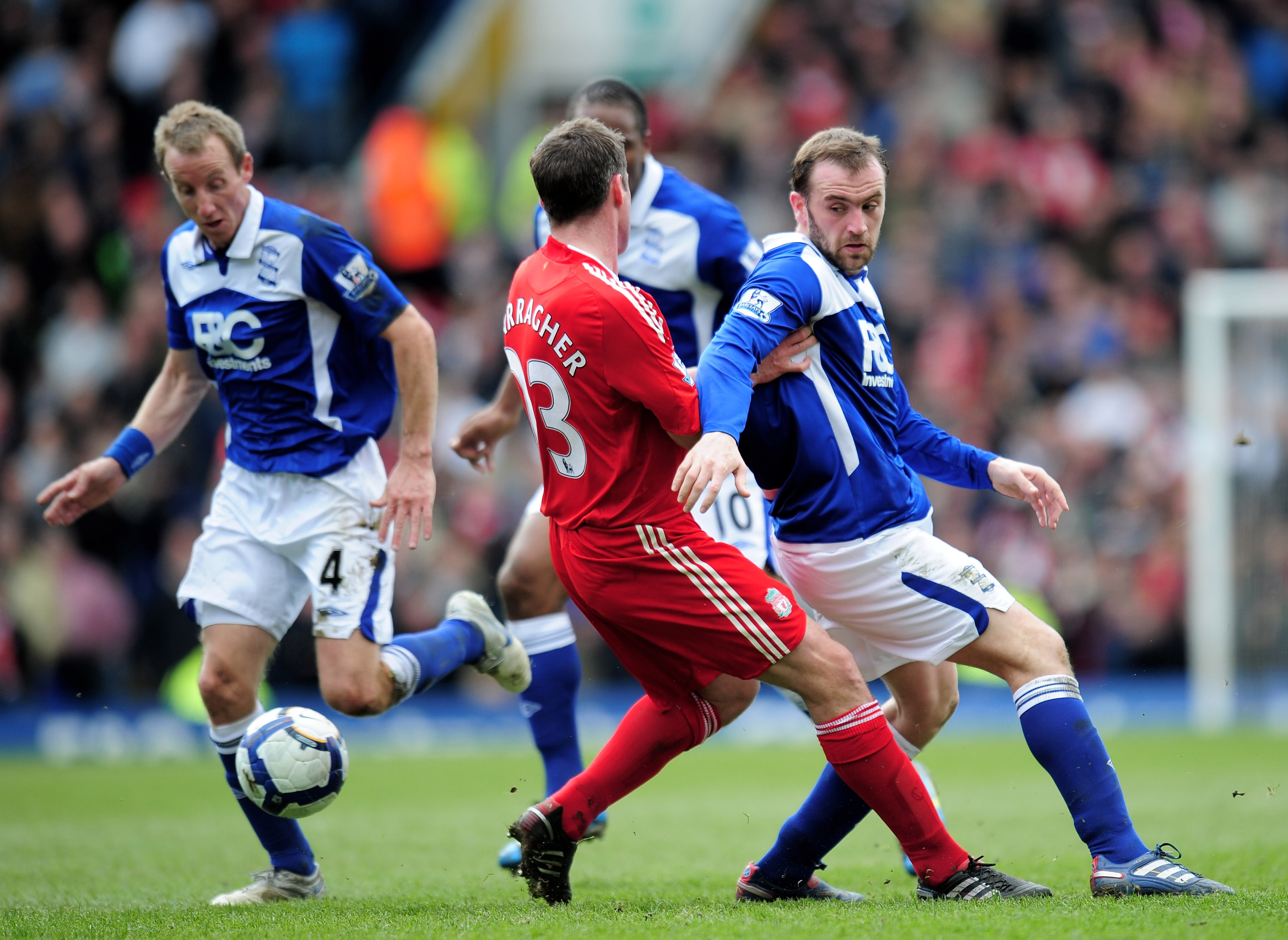 BIRMINGHAM, ENGLAND - APRIL 04:  James McFadden of Birmingham City is challenged by Jamie Carragher of Liverpool during the Barclays Premier League match between Birmingham City and Liverpool at St. Andrews Stadium on April 4, 2010 in Birmingham, England.