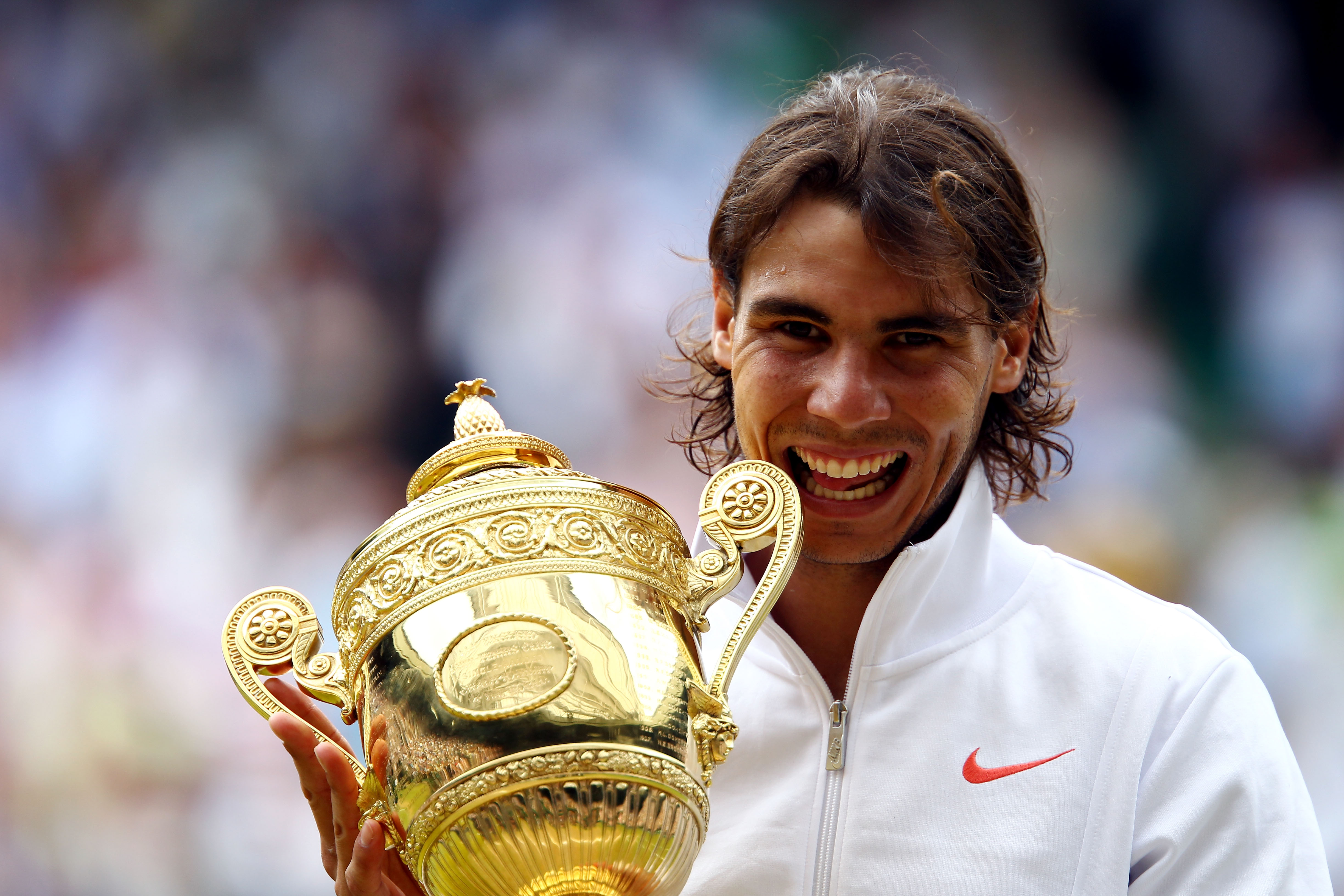 LONDON, ENGLAND - JULY 04:  Rafael Nadal of Spain holds the Championship trophy after winning the Men's Singles Final match against Tomas Berdych of Czech Republic on Day Thirteen of the Wimbledon Lawn Tennis Championships at the All England Lawn Tennis a
