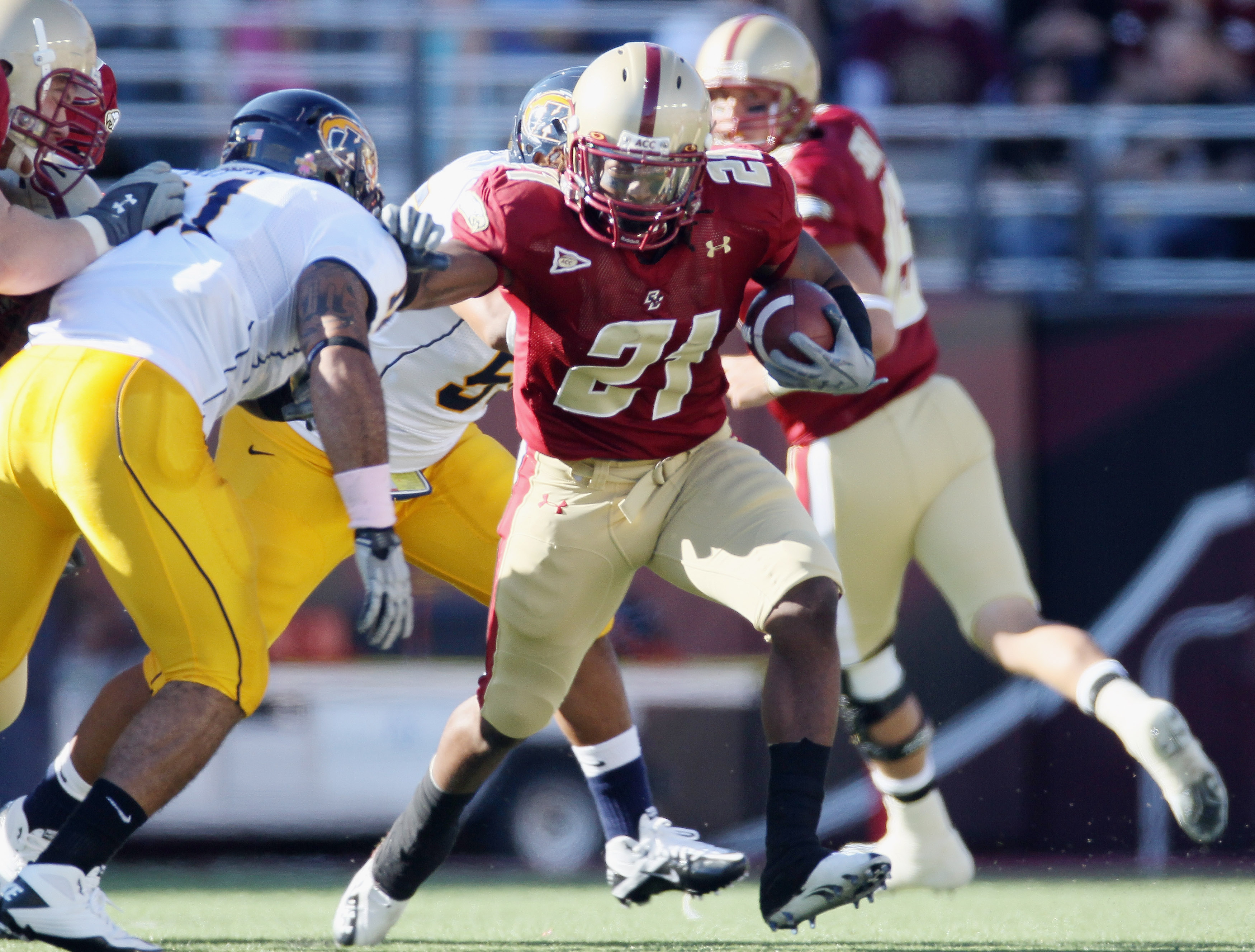 CHESTNUT HILL, MA - SEPTEMBER 11: Sterlin Phifer #21 of the Boston College Eagles carries the ball as Cobrani Mixon #11 of the Kent State Golden Flashes defends on September 11, 2010 at Alumni Stadium in Chestnut Hill, Massachusetts. Boston College def