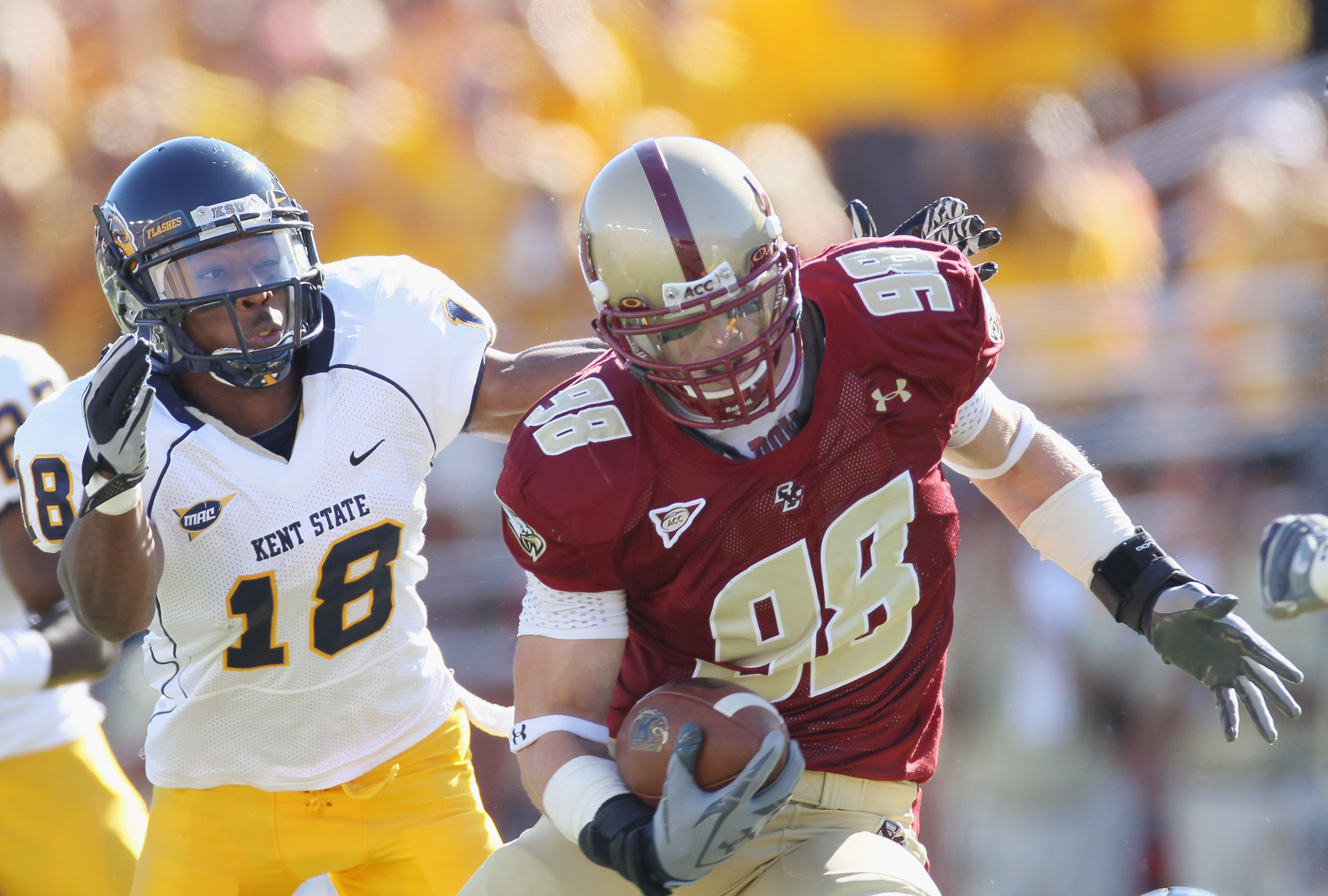 CHESTNUT HILL, MA - SEPTEMBER 11: Alex Albright #98 of the Boston College Eagles carries the ball after he intercepted a pass as Sam Kirkland #18 of the Kent State Golden Flashes defends on September 11, 2010 at Alumni Stadium in Chestnut Hill, Massachus