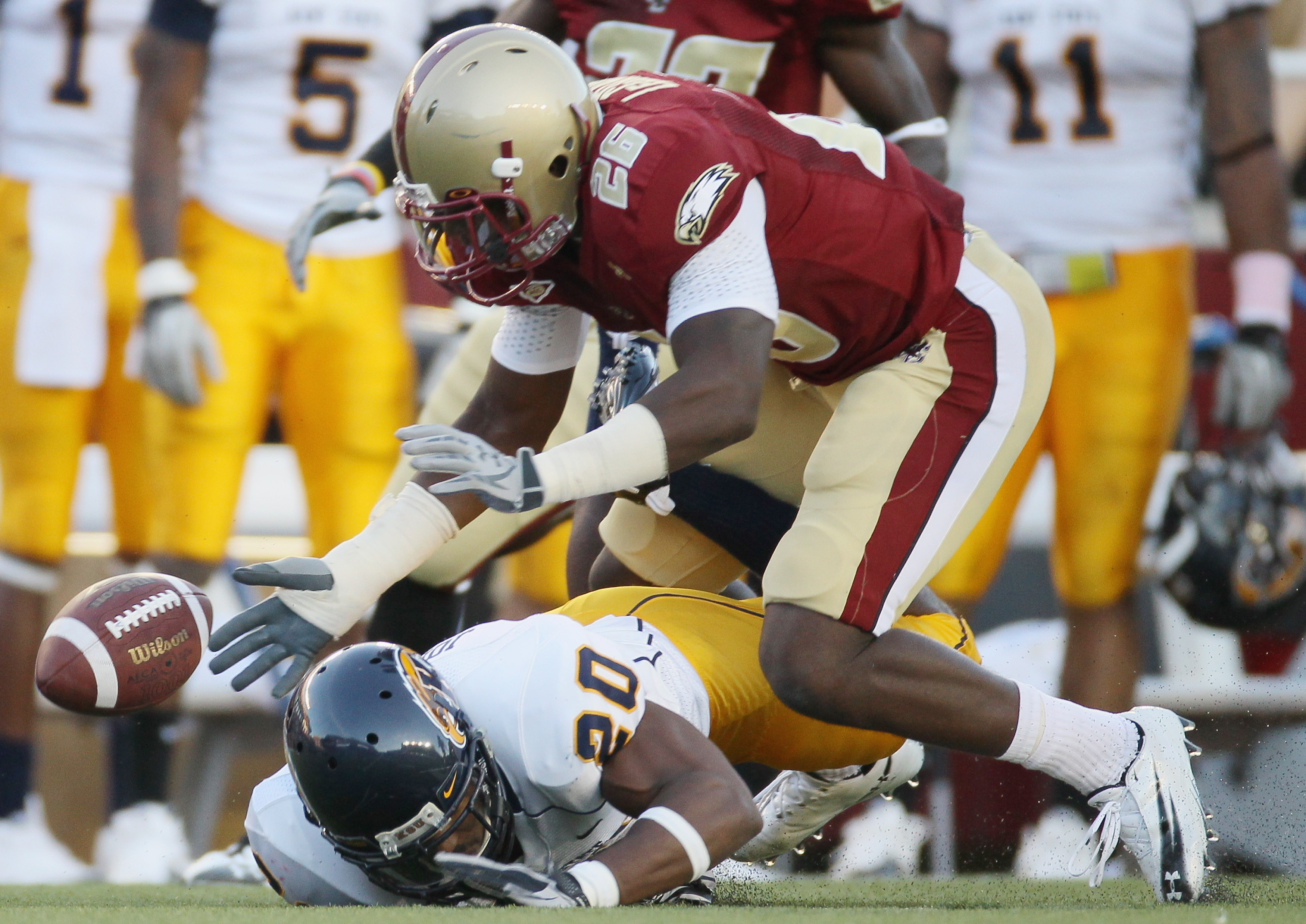 CHESTNUT HILL, MA - SEPTEMBER 11: Dominick LeGrande #26 of the Boston College Eagles and Will Johnson #20 of the Kent State Golden Flashes chase after the fumble on September 11, 2010 at Alumni Stadium in Chestnut Hill, Massachusetts. Boston College defe