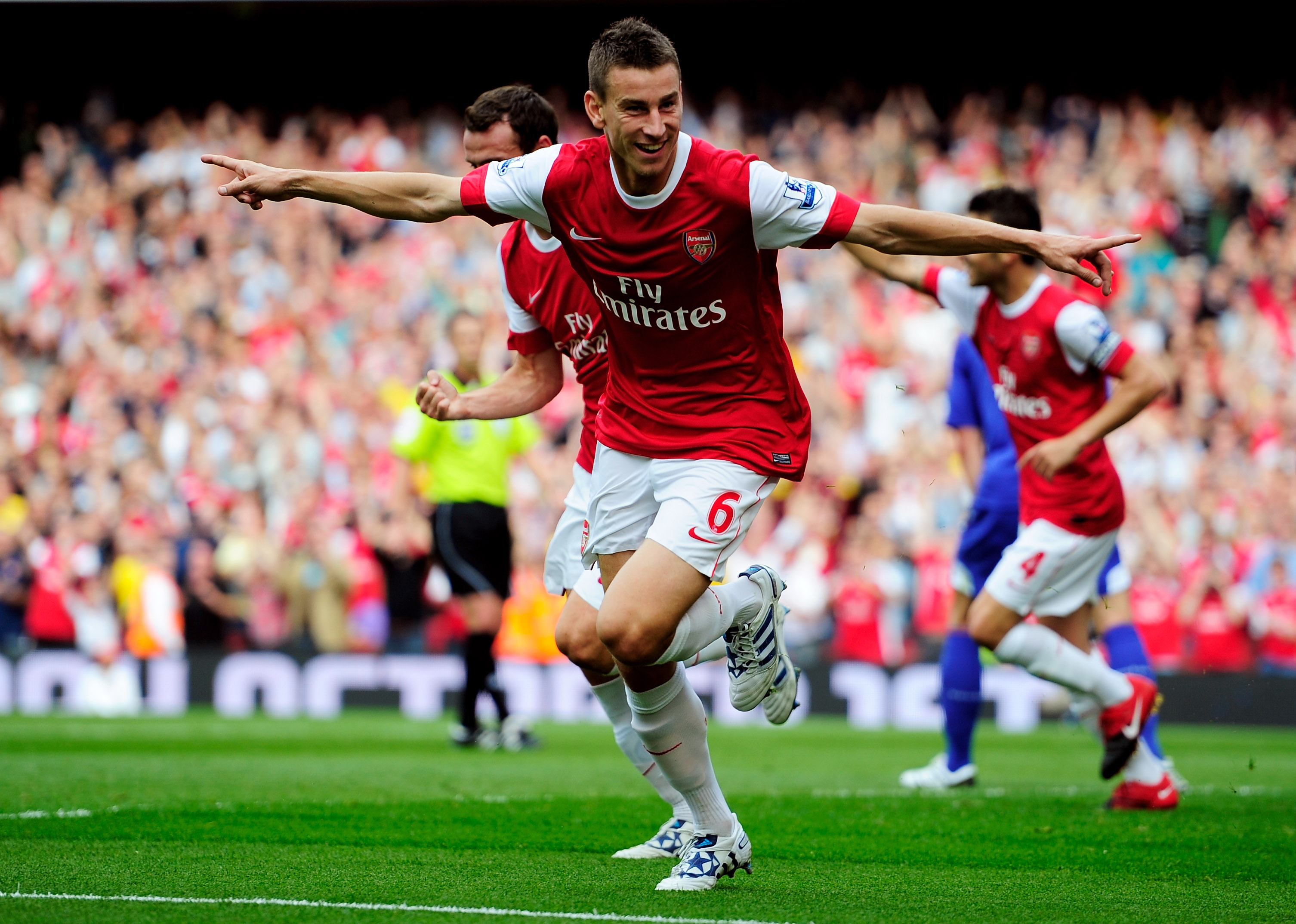 LONDON, ENGLAND - SEPTEMBER 11:  Laurent Koscielny of Arsenal celebrates after he scores the first goal of the game during the Barclays Premier League match between Arsenal and Bolton Wanderers at The Emirates Stadium on September 11, 2010 in London, Engl
