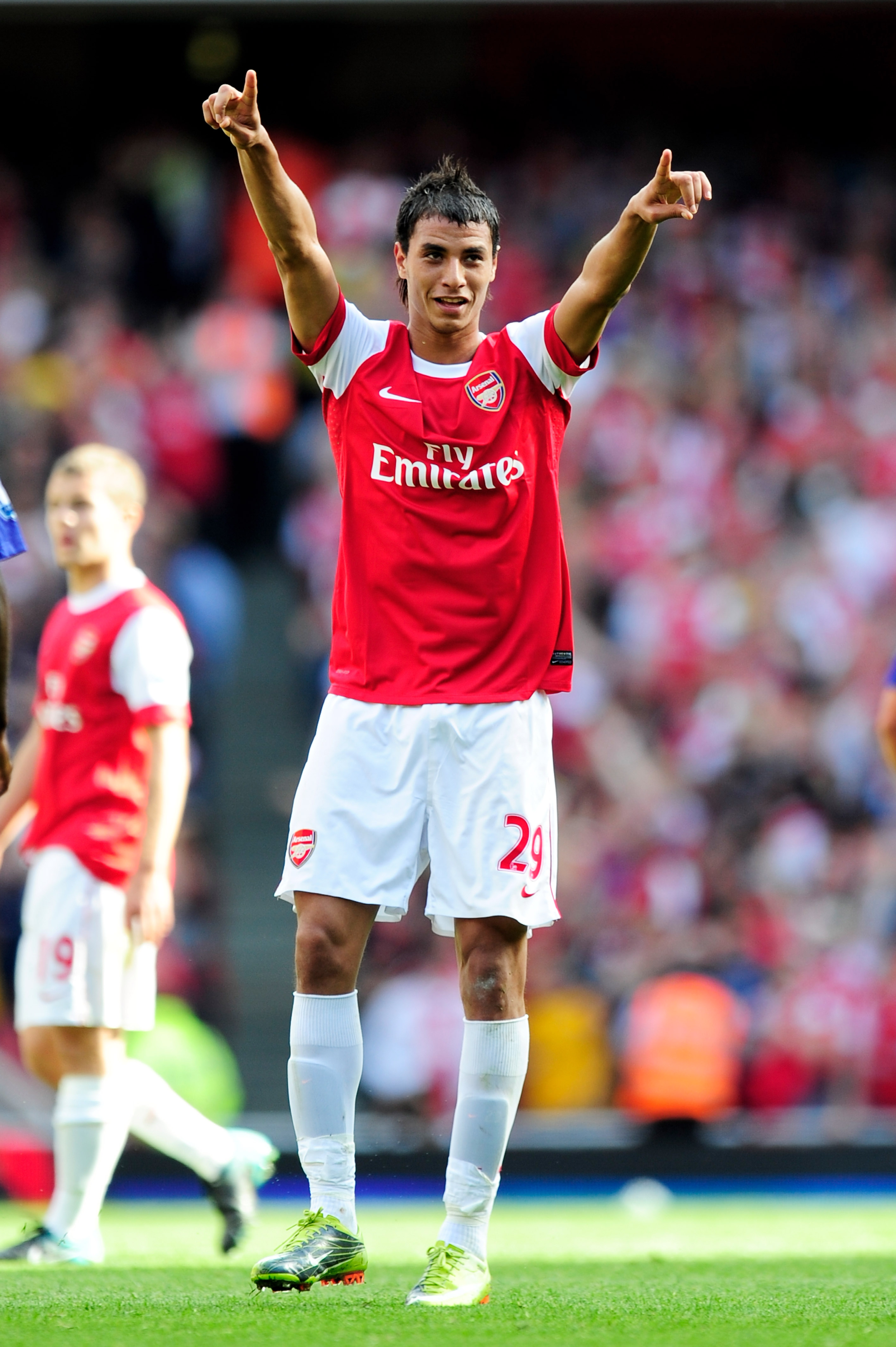 LONDON, ENGLAND - SEPTEMBER 11:  Marouane Chamakh of Arsenal celebrates after he scores his teams second goal during the Barclays Premier League match between Arsenal and Bolton Wanderers at The Emirates Stadium on September 11, 2010 in London, England.