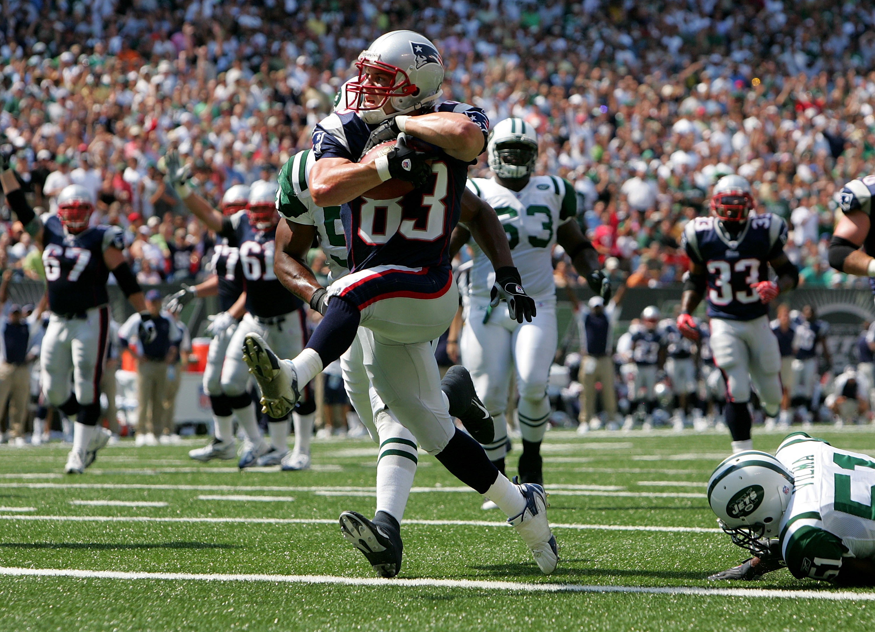 EAST RUTHERFORD, NJ - SEPTEMBER 09:  Wes Welker #83 of  the New England Patriots runs in a touchdown in the first quarter agaisnt the New York Jets on September 9, 2007 at Giants Stadium in East Rutherford, New Jersey.  (Photo by Nick Laham/Getty Images)