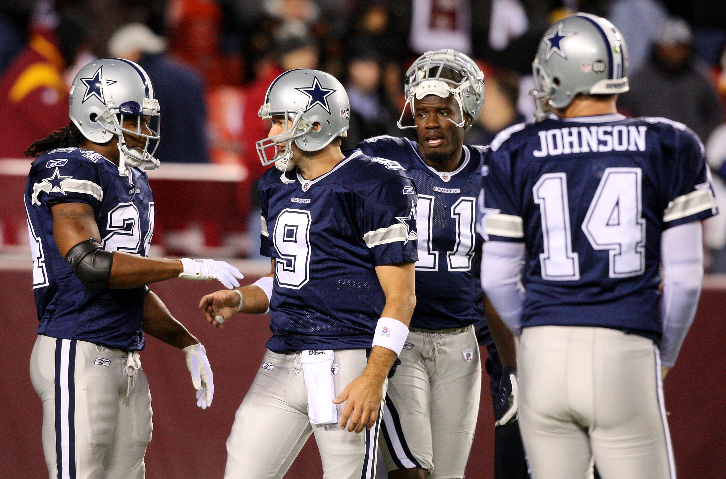 Dallas Cowboys' Roy Williams wears the jersey of teammate Marion