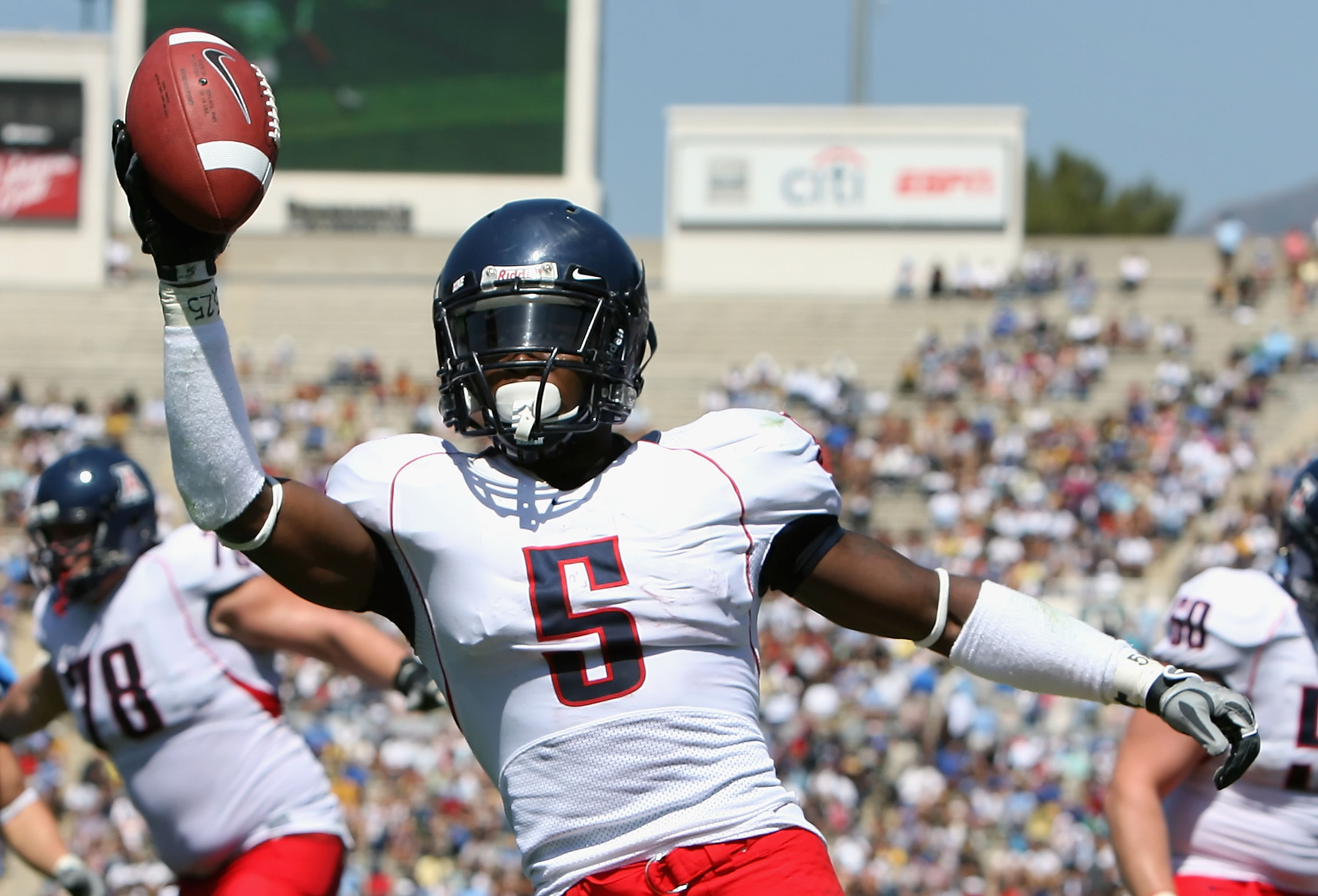 PASADENA, CA - SEPTEMBER 20: Running back Nic Grigsby #5 of the Arizona Wildcats celebrates after scoring a 3 yard rushing touchdown against the UCLA Bruins during the second quarter of the college football game at the Rose Bowl on September 20, 2008 in