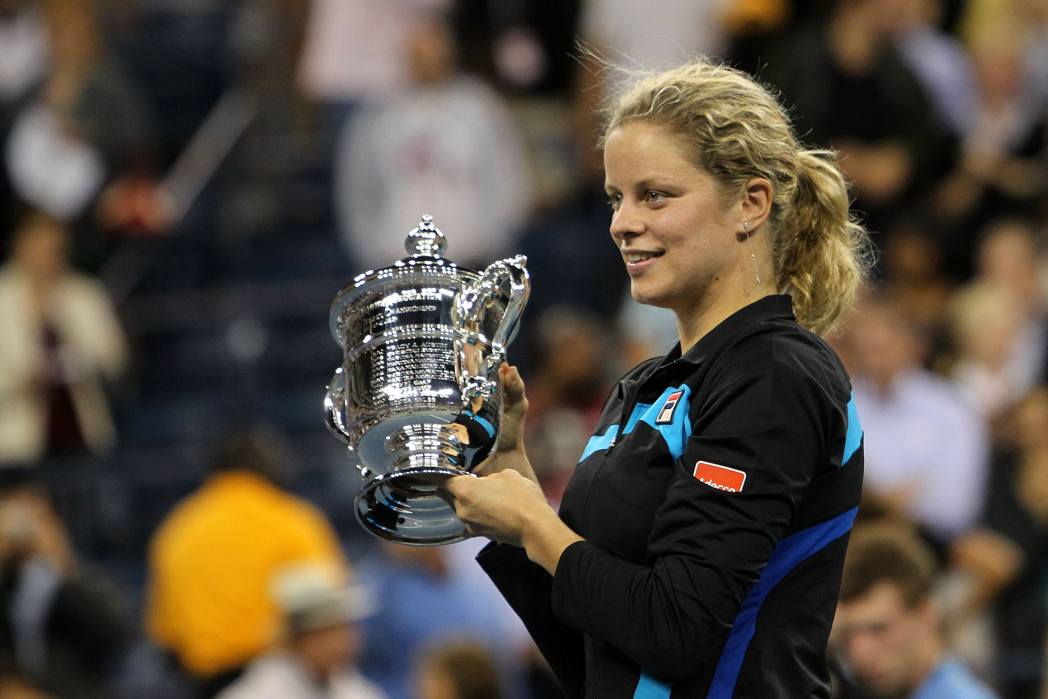 NEW YORK - SEPTEMBER 11:  Kim Clijsters of Belguim celebrates with the trophy after defeating Vera Zvonareva of Russia during their women's singles final on day thirteen of the 2010 U.S. Open at the USTA Billie Jean King National Tennis Center on Septembe