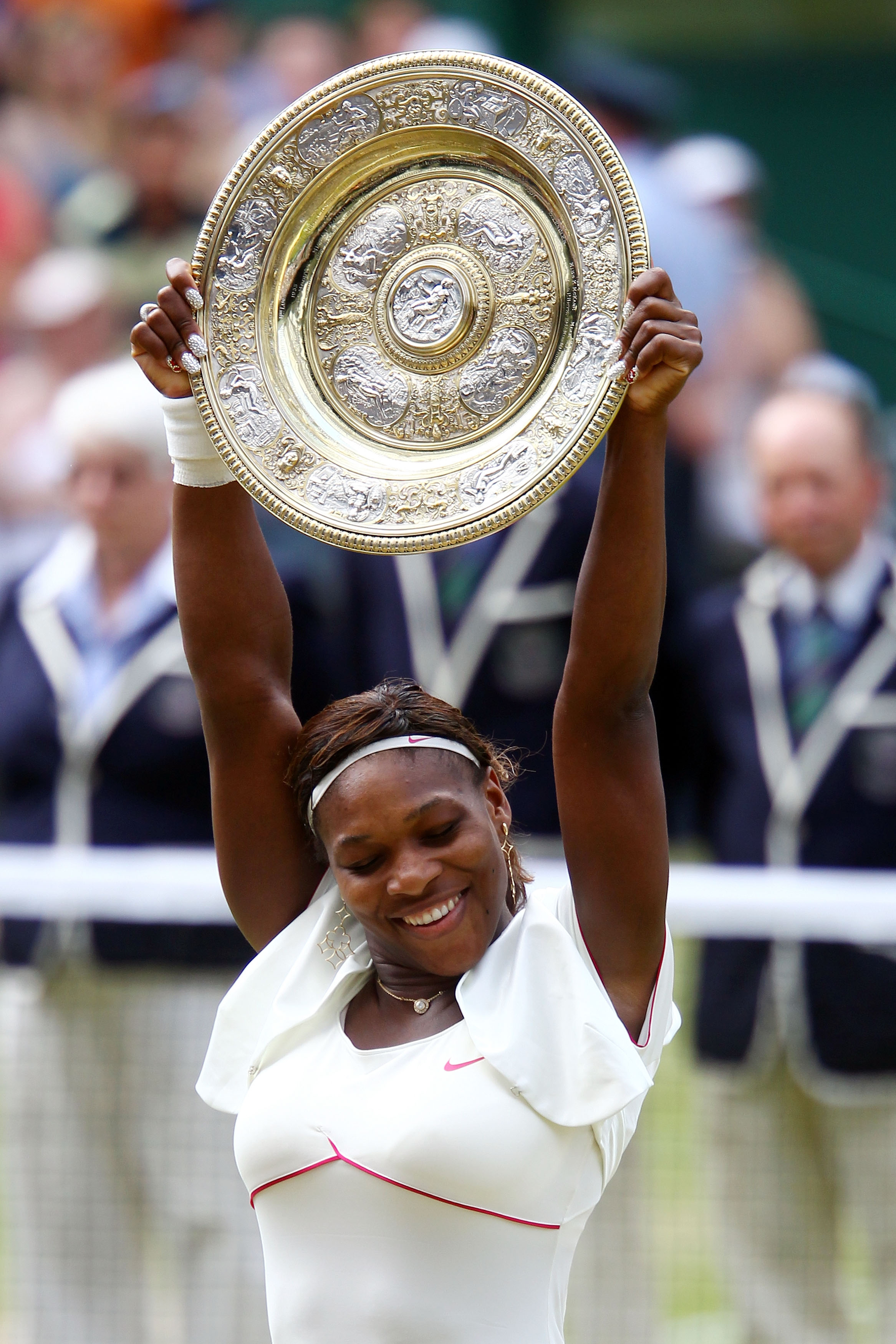 LONDON, ENGLAND - JULY 03:  Serena Williams of USA lifts the Championship trophy after winning her Ladies Singles Final Match against Vera Zvonareva of Russia on Day Twelve of the Wimbledon Lawn Tennis Championships at the All England Lawn Tennis and Croq
