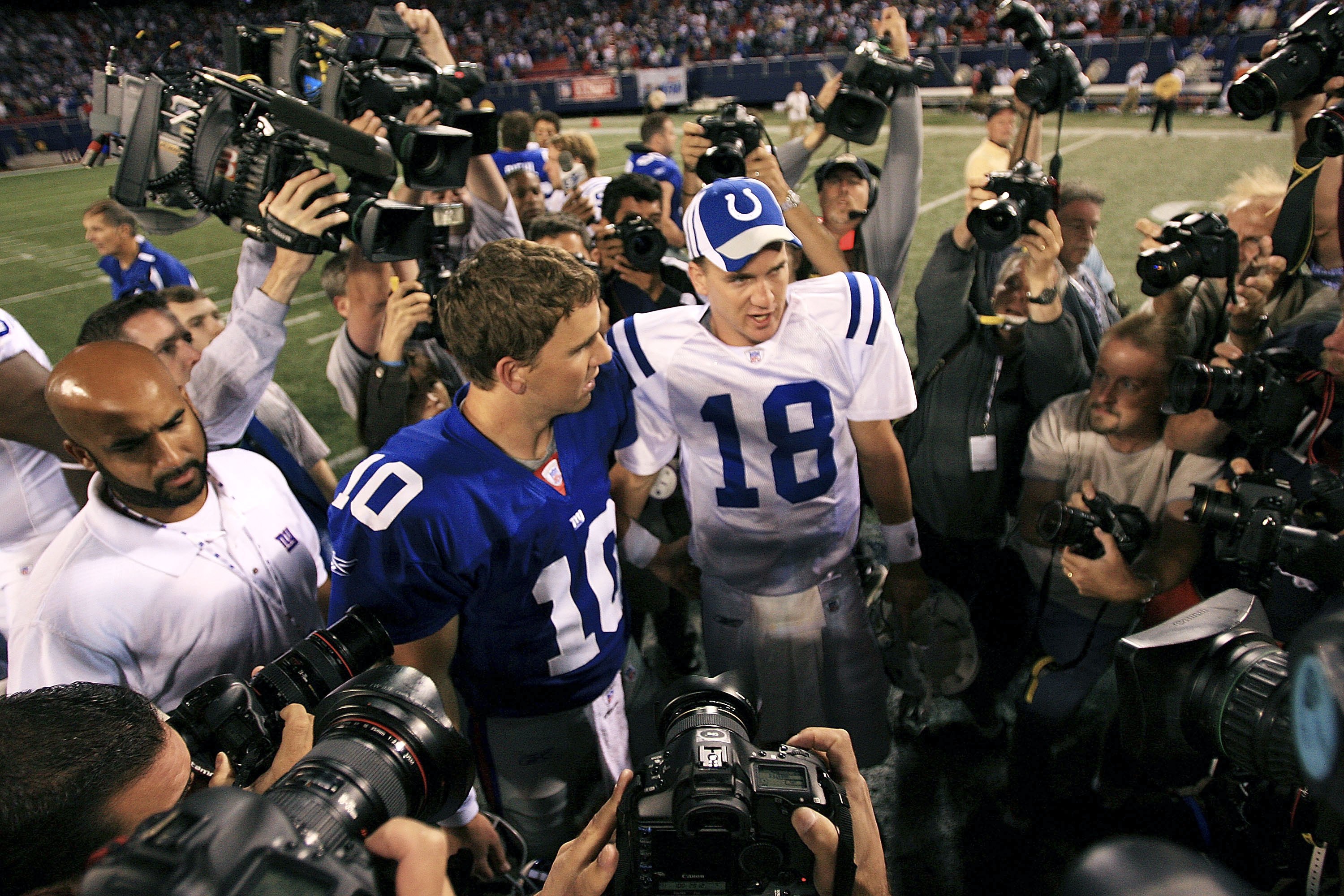 New York Giants Eli Manning and Indianapolis Colts Peyton Manning exchange  words while walking off of the field in week 1 at Giants Stadium in East  Rutherford, New Jersey on September 10