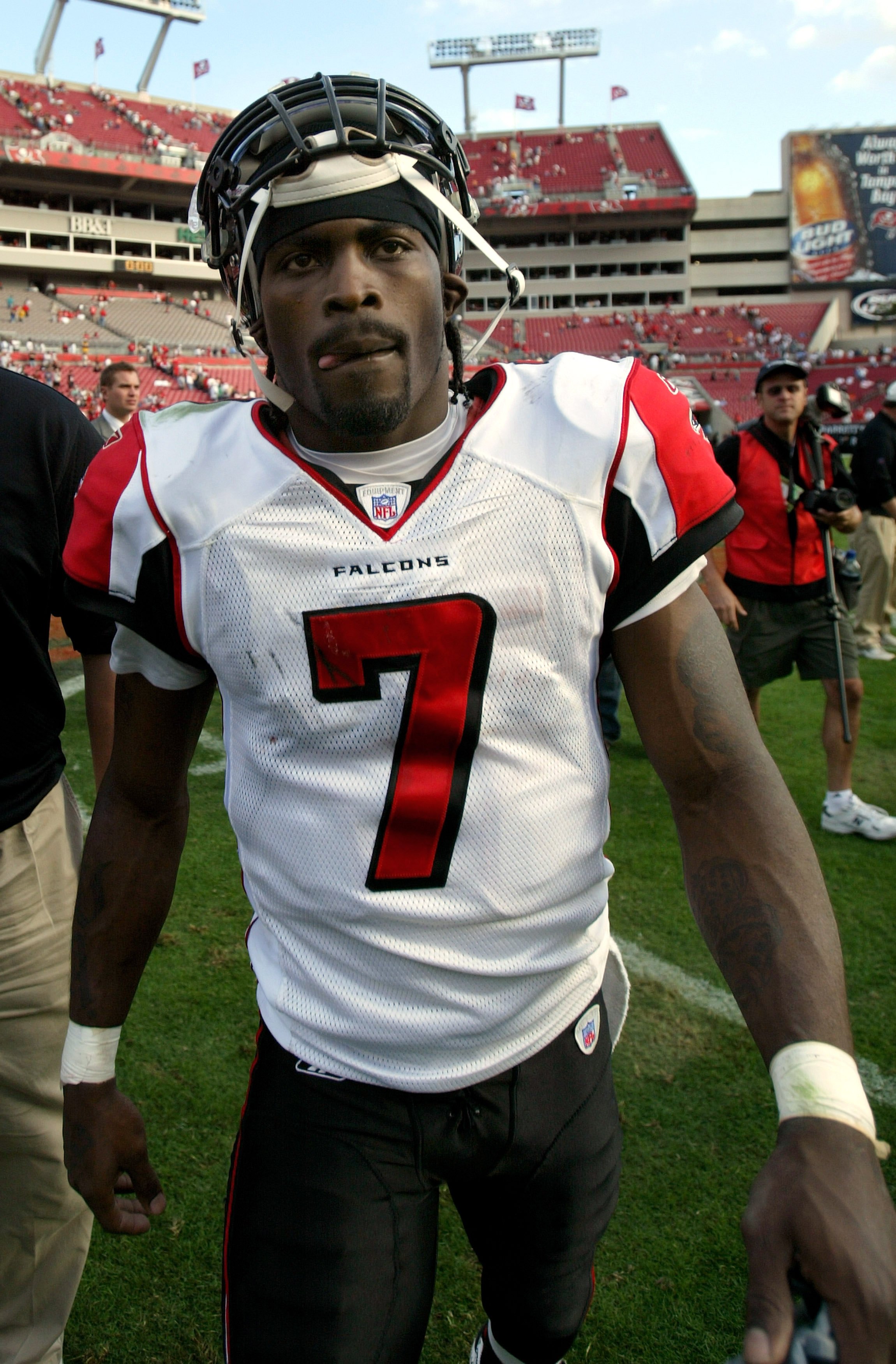 TAMPA, FL - DECEMBER 10:  Quarterback Michael Vick #7 of the Atlanta Falcons leaves the field after the Falcons defeated the Tampa Bay Buccaneers on December 10, 2006 at Raymond James Stadium in Tampa, Florida. The Falcons defeated the Buccaneers 17-6.  (