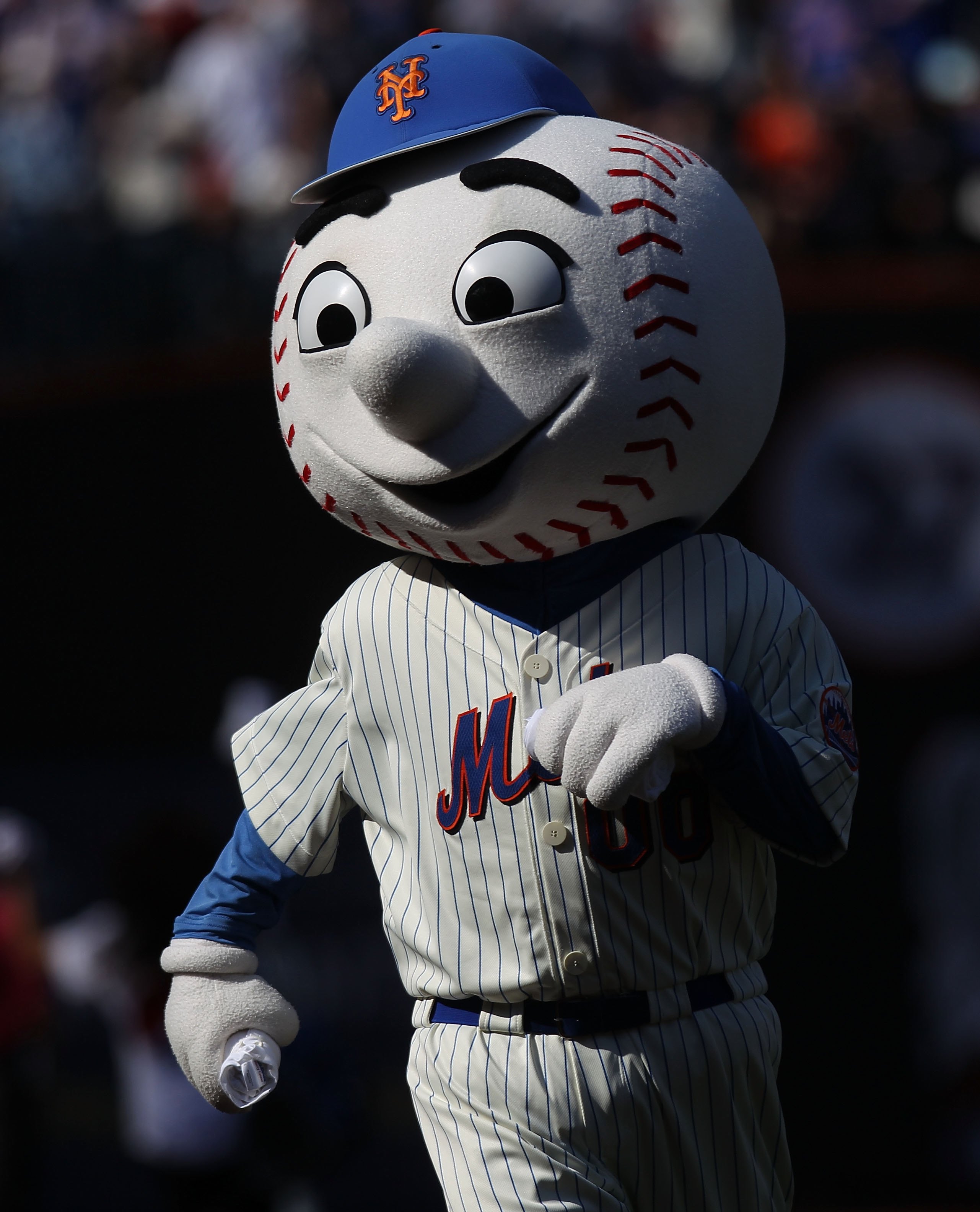 NEW YORK - APRIL 05:  Mr. Met dances during the game between the New York Mets and the Florida Marlins during their Opening Day Game at Citi Field on April 5, 2010 in the Flushing neighborhood of the Queens borough of New York City.  (Photo by Nick Laham/