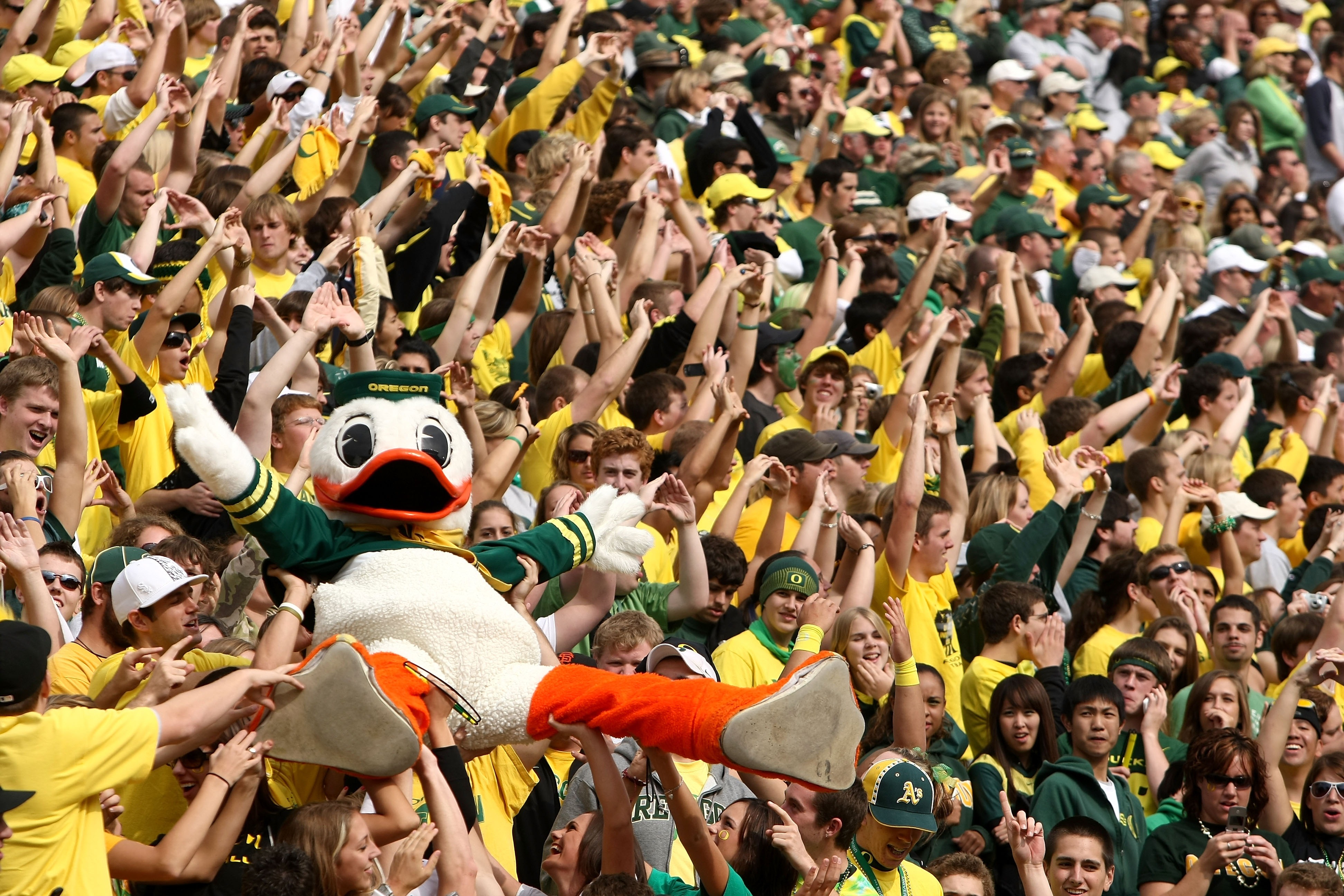 EUGENE, OR - OCTOBER 13:   The Oregon Duck mascot is carried by the crowd against the Washington State Cougars at Autzen Stadium October 13, 2007 in Eugene, Oregon.  (Photo by Jonathan Ferrey/Getty Images)