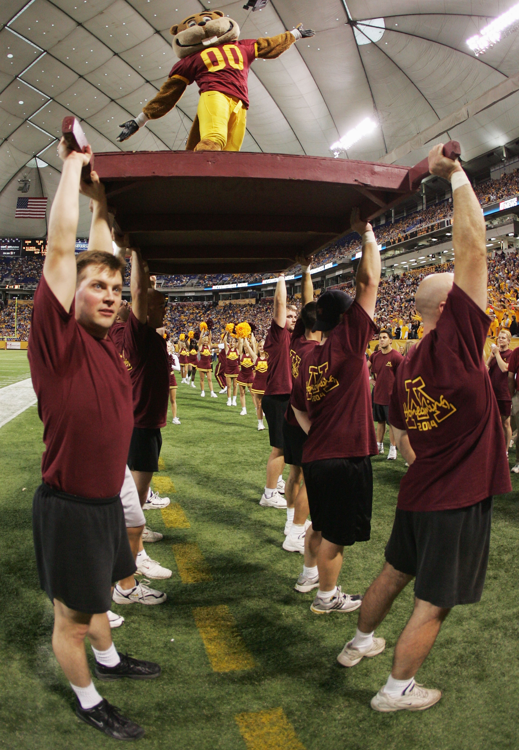 MINNEAPOLIS - OCTOBER 23:  Minnesota mascot 'Goldy' the gopher is hoisted up after a touchdown in the fourth quarter against Illinois at the Hubert H. Humphrey Metrodome on October 23, 2004 in Minneapolis, Minnesota. Minnesota defeated Illinois 45-0. (Pho