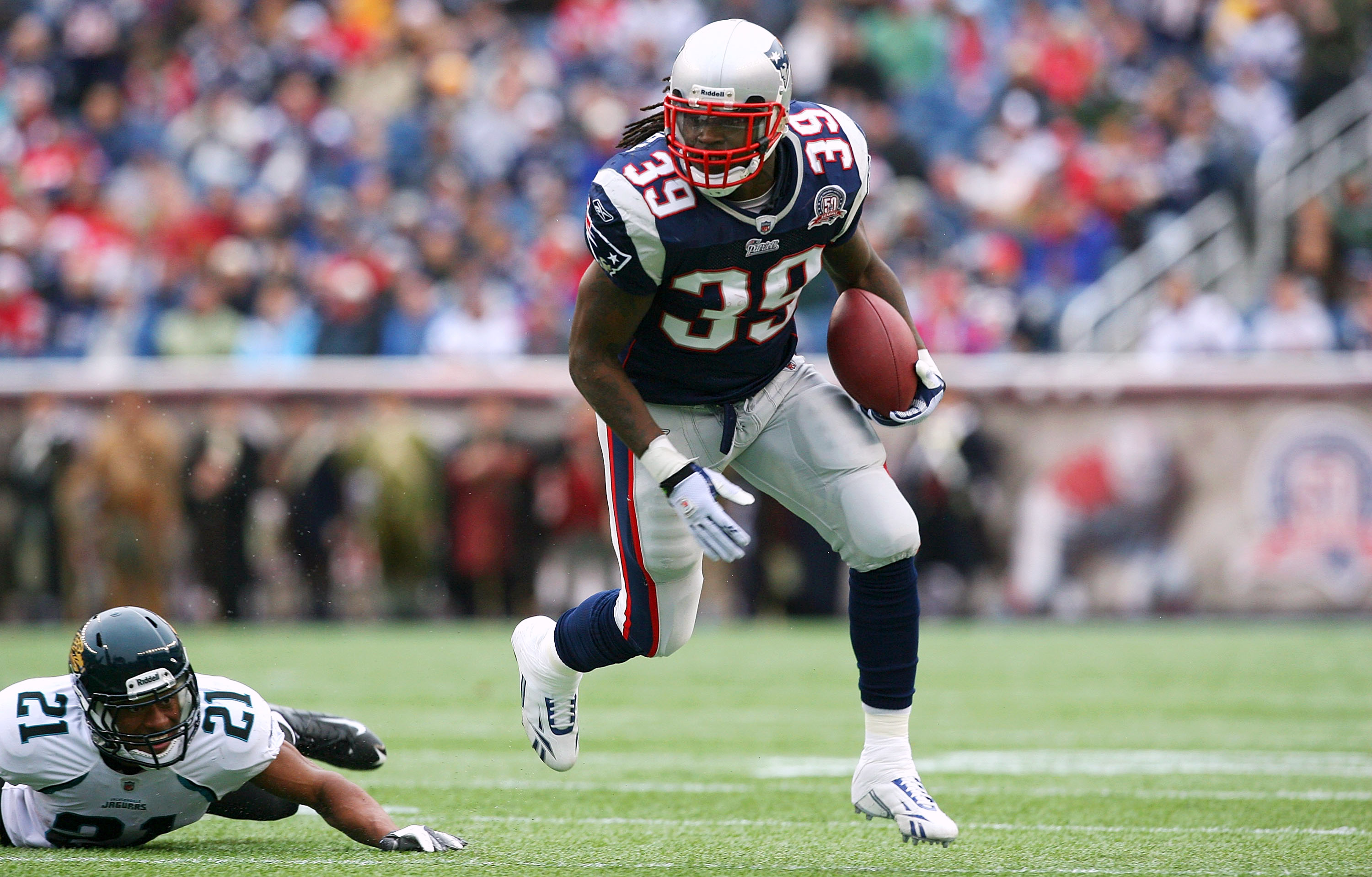 FOXBORO, MA - DECEMBER 27:  Laurence Maroney #39 of the New England Patriots gains yards against Derek Cox #21 of the Jacksonville Jaguars in the first quarter at Gillette Stadium on December 27, 2009 in Foxboro, Massachusetts. (Photo by Jim Rogash/Getty