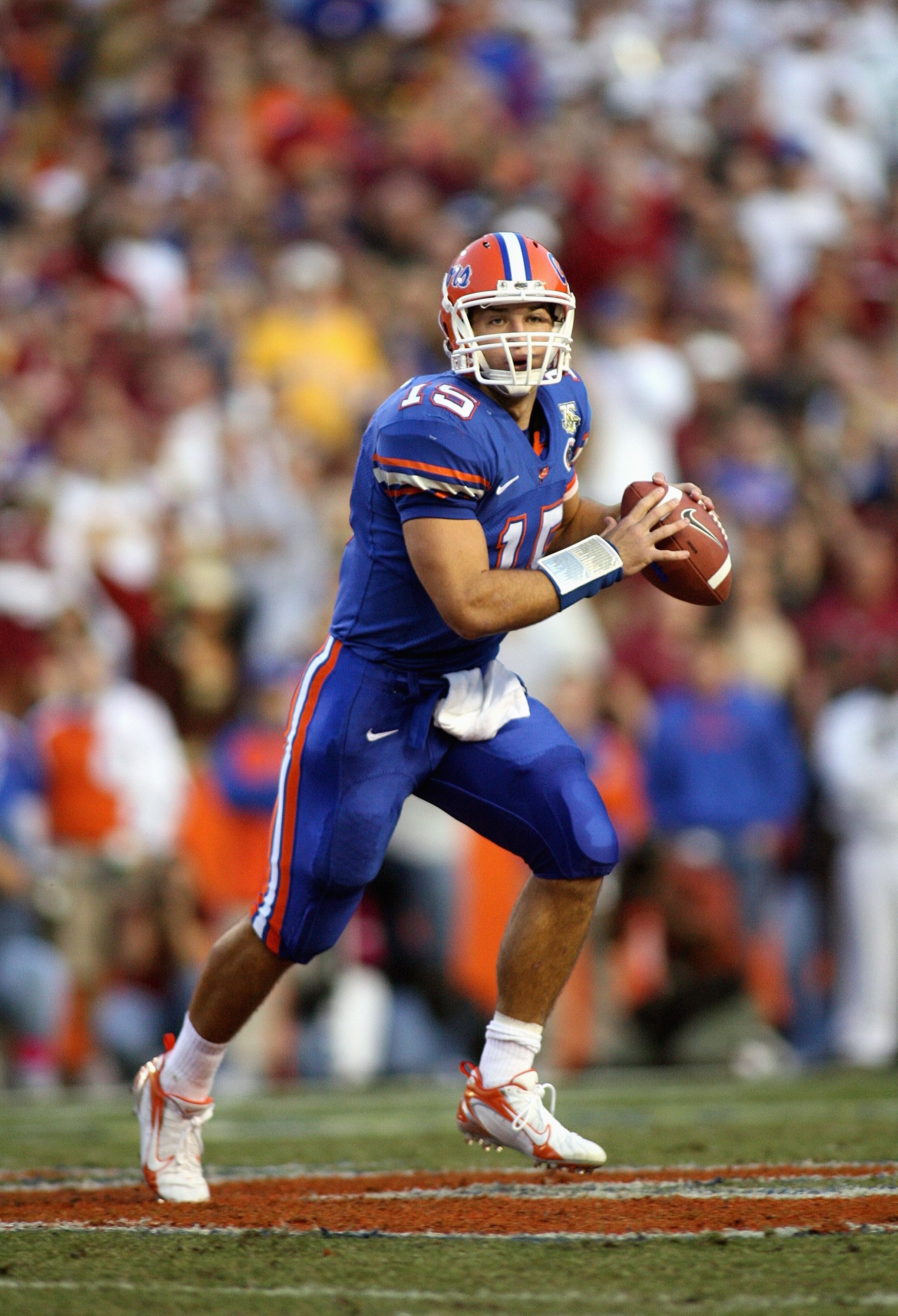 Quarterback Tim Tebow #15 of the Florida Gators rolls out against the  Florida State Seminoles at Ben H…