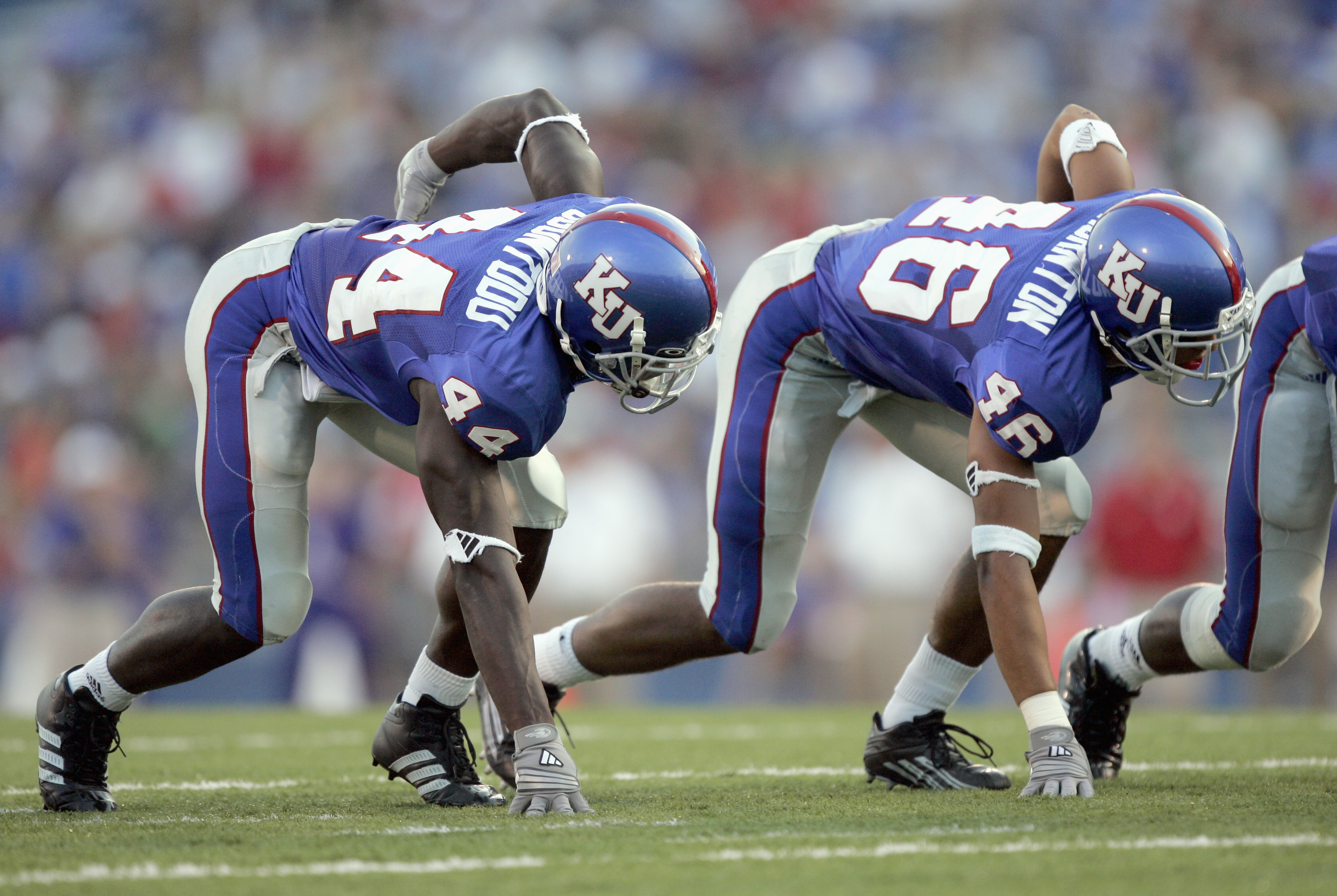 LAWRENCE, KS - SEPTEMBER 9: Olaitan Oguntodu #44 and Justin Thornton #46 of the Kansas Jayhawks line up against the Louisiana Monroe Warhawks in the first quarter on September 9, 2006 at Memorial Stadium in Lawrence, Kansas. (Photo by Brian Bahr/Getty Ima
