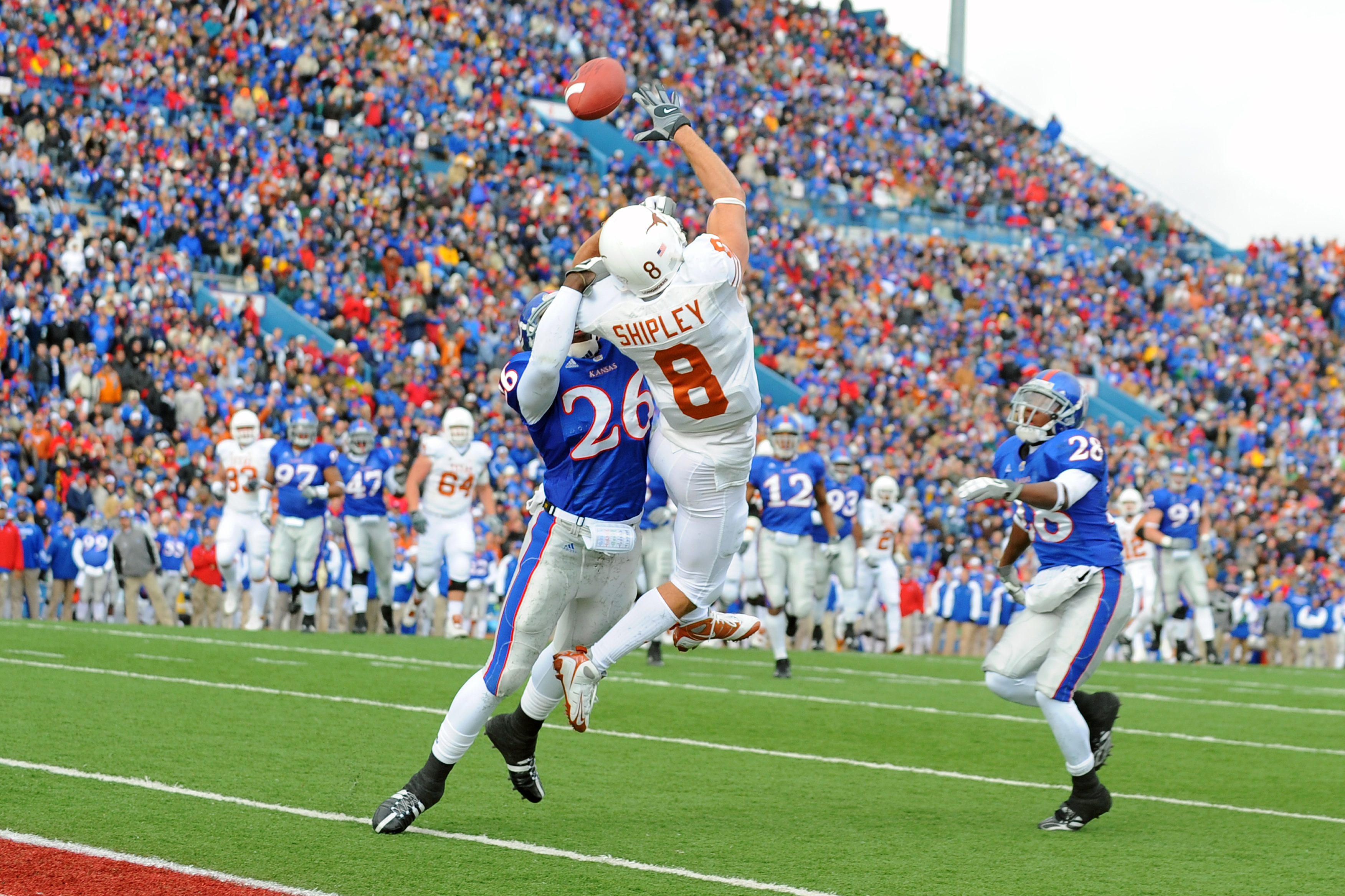 LAWRENCE, KS - NOVEMBER 15: Jordan Shipley #8 of the Texas Longhorns attempts to make a reception as Phillip Strozier #26 of the Kansas Jayhawks defends on November 15, 2008 at Memorial Stadium in Lawrence, Kansas. Texas defeated Kansas 35-7. (Photo by