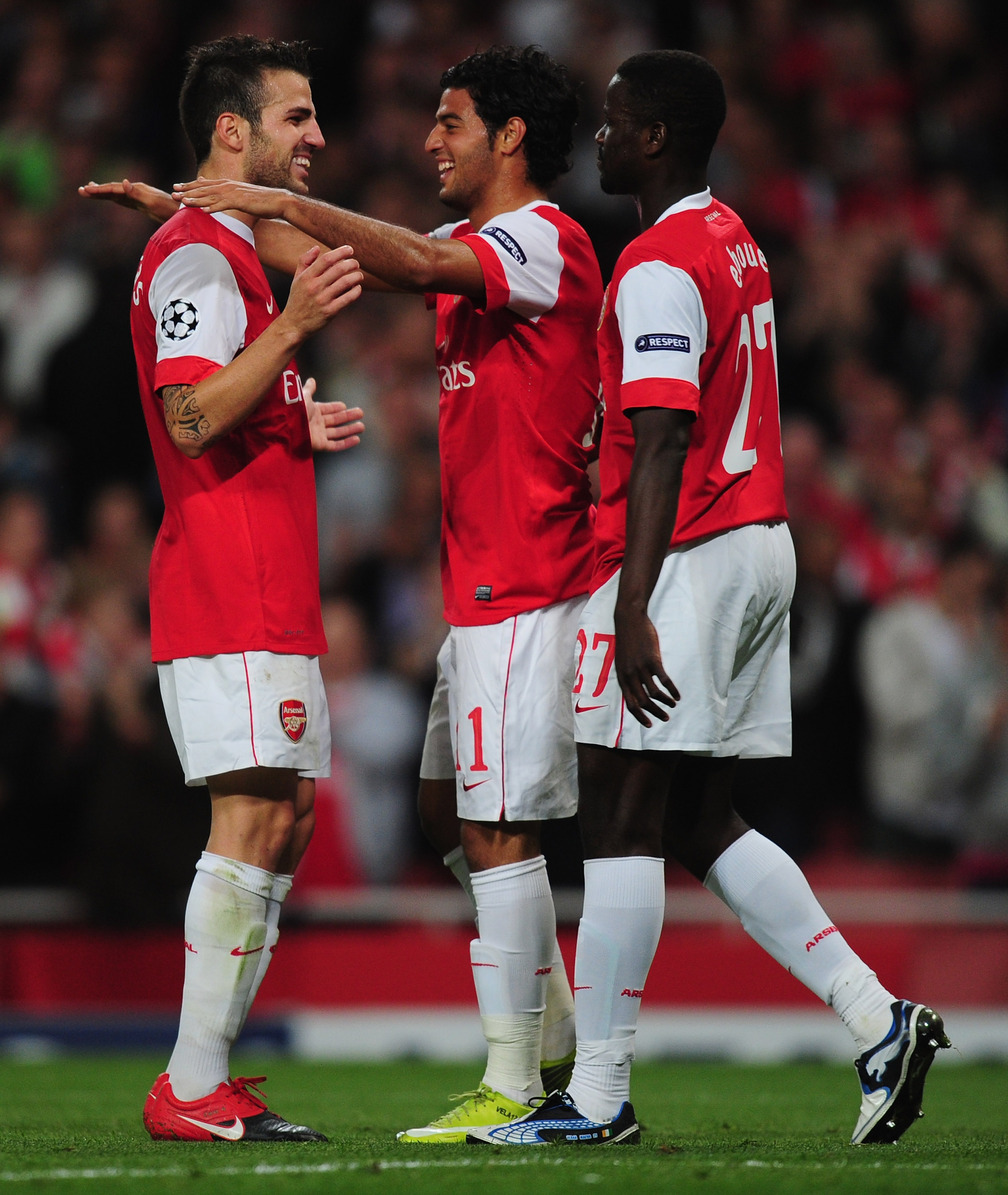 LONDON, ENGLAND - SEPTEMBER 15:  Carlos Vela of Arsenal celebrates with team mate Cesc Fabregas after scoring his teams sixth goal during the UEFA Champions League Group H match between Arsenal and SC Braga at the Emirates Stadium on September 15, 2010 in
