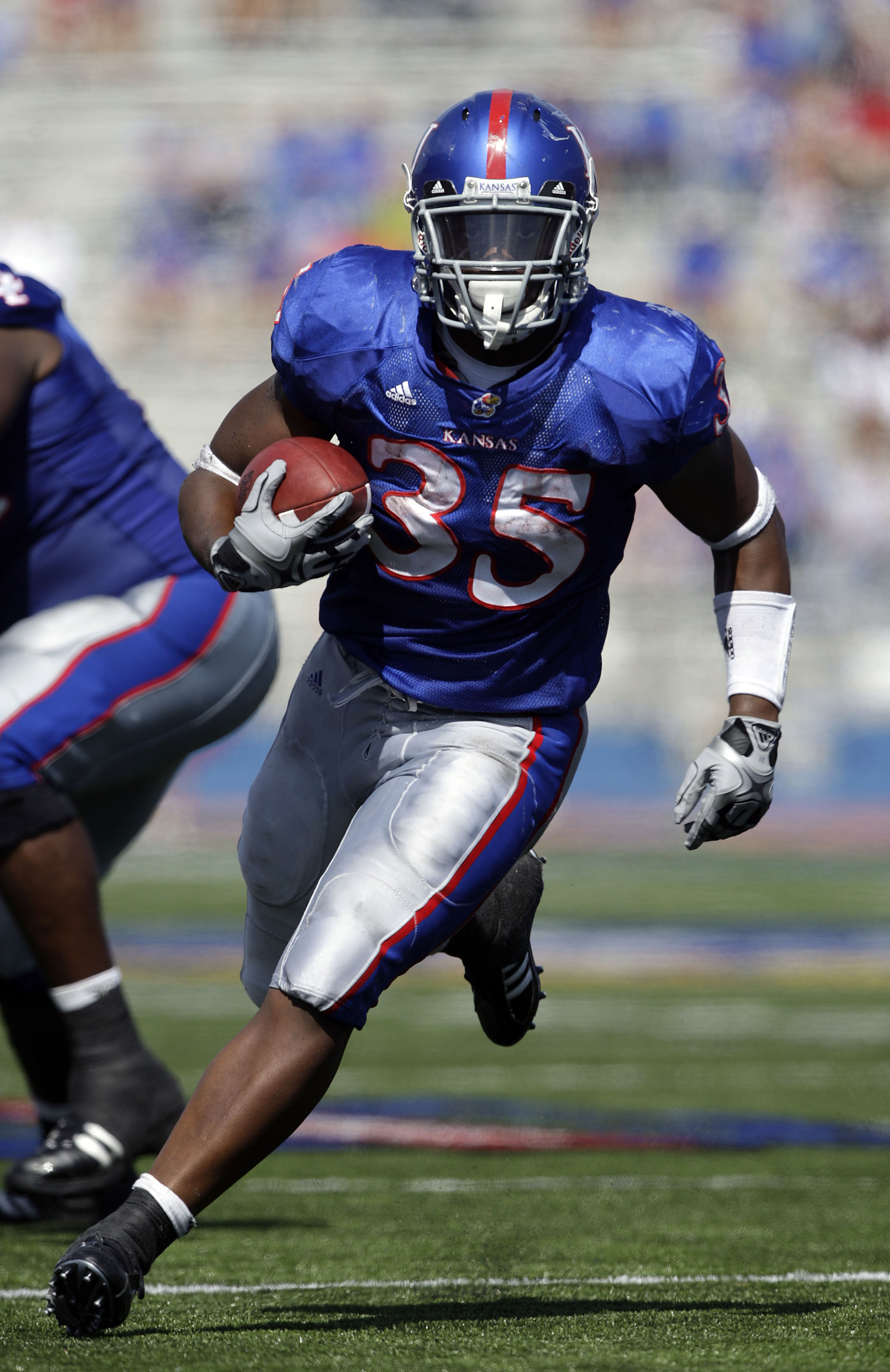 LAWRENCE, KS - SEPTEMBER 19: Running back Toben Opurum #35 of the Kansas Jayhawks carries the ball upfield during the game against the Duke Blue Devils on Kivisto Field at Memorial Stadium on September 19, 2009 in Lawrence, Kansas. (Photo by Jamie Squi